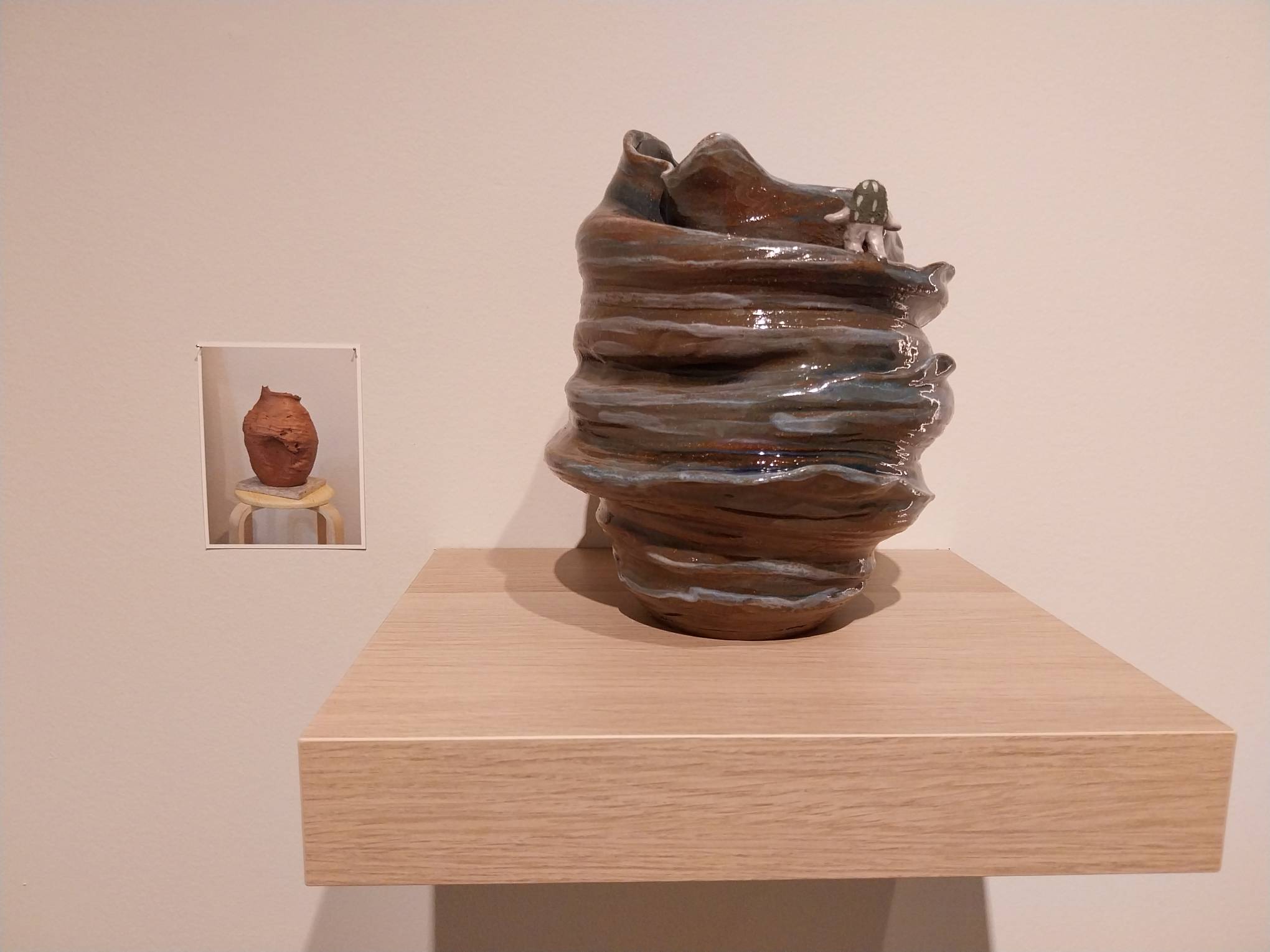 One work by Genavee Lazaro and JD Yu with the in-progress photo.