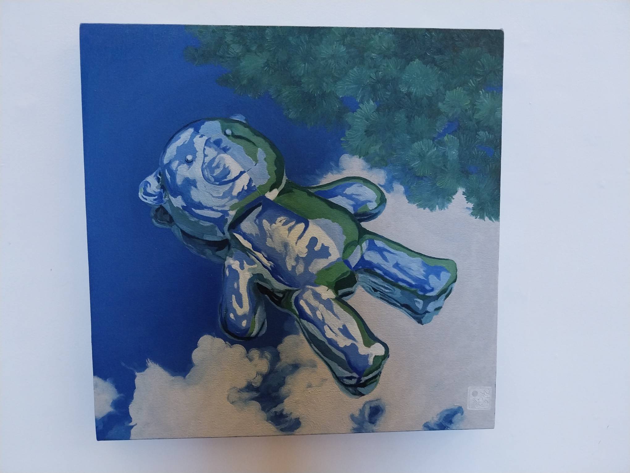 A metallic teddy bear floating in water. Made by Patty Py, exhibited at White Walls Gallery.