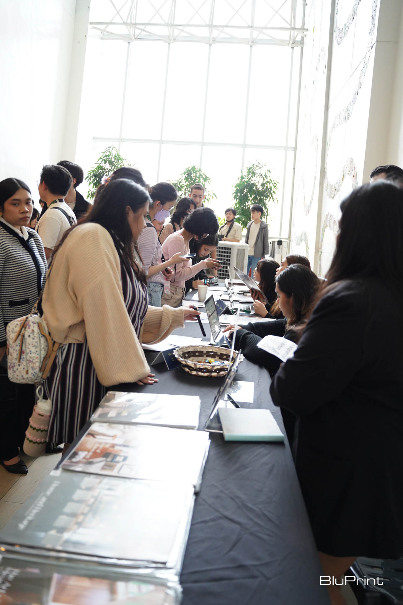 Registration booth with students lined up.
