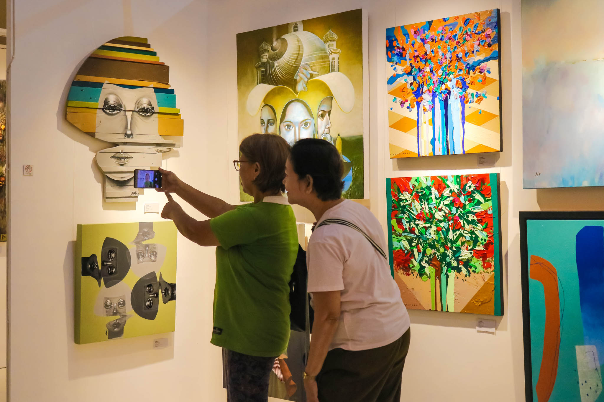 Two elderly people taking a picture.