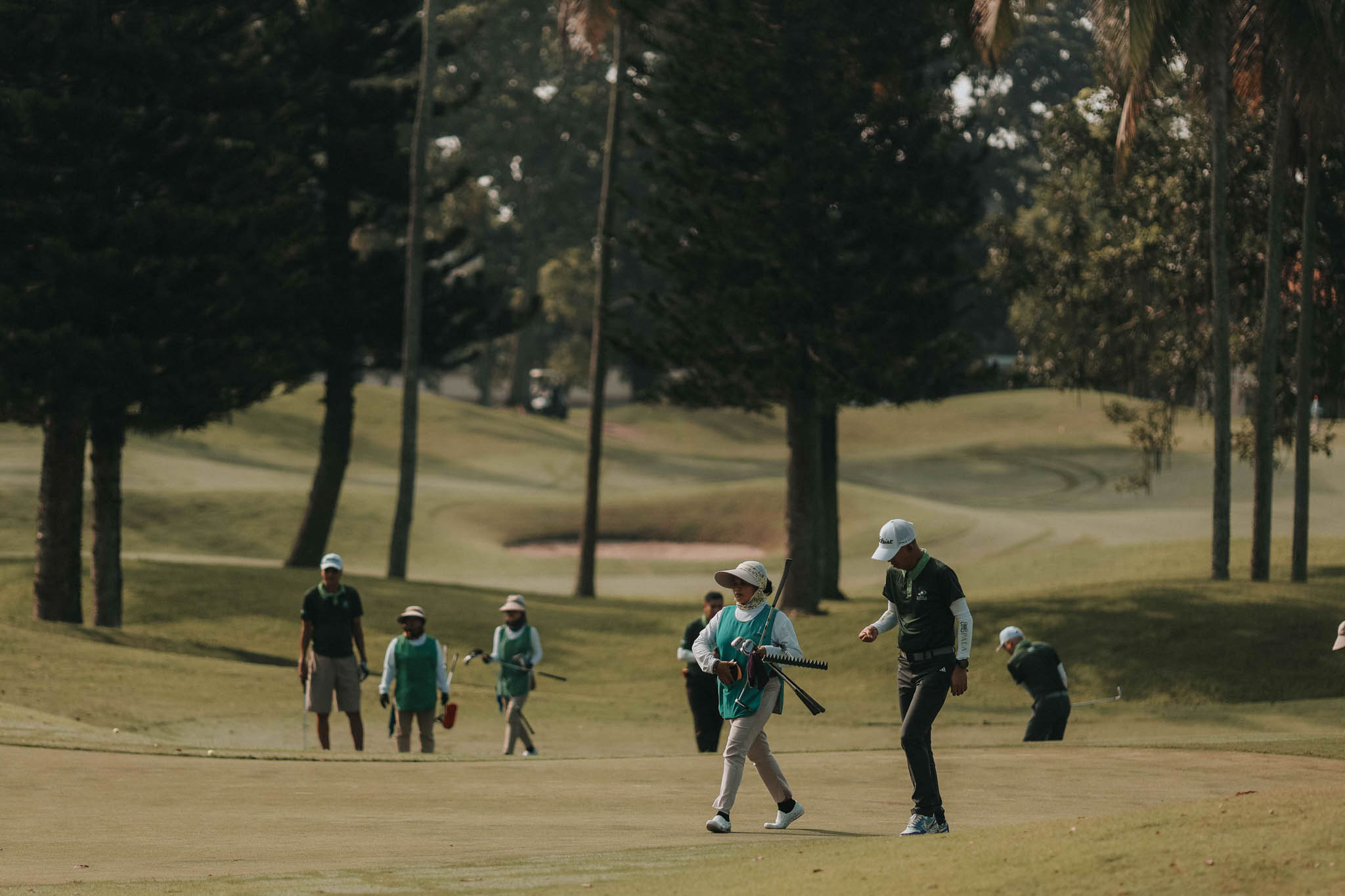 BluPrint 2024 October In-Article PALA Golf Tournament-362 - BluPrint Participants walking on a golf course during a golf tournament.