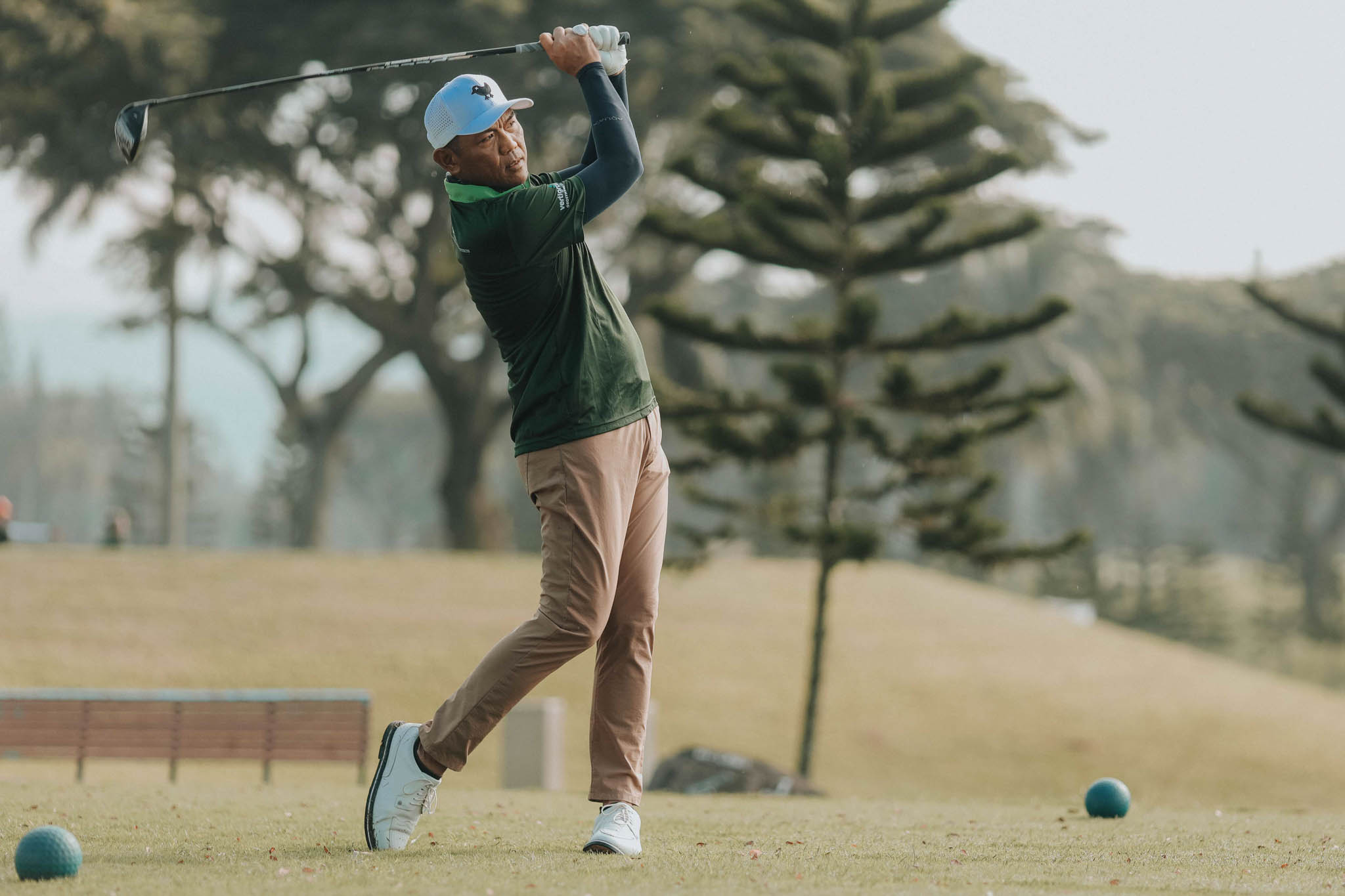 BluPrint 2024 October In-Article PALA Golf Tournament-392 - BluPrint A participant just finished swinging is golf club at a golf tournament.