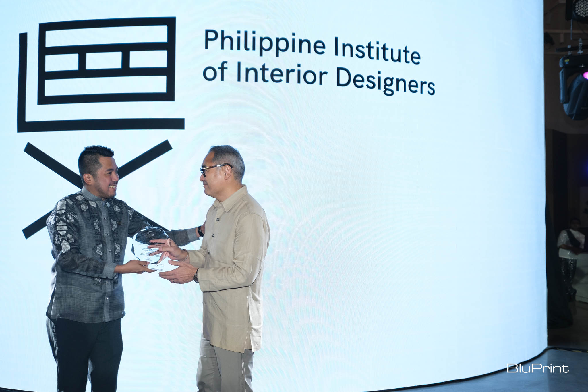 PIID National President Paolo Castro giving an award to Ed Calma.