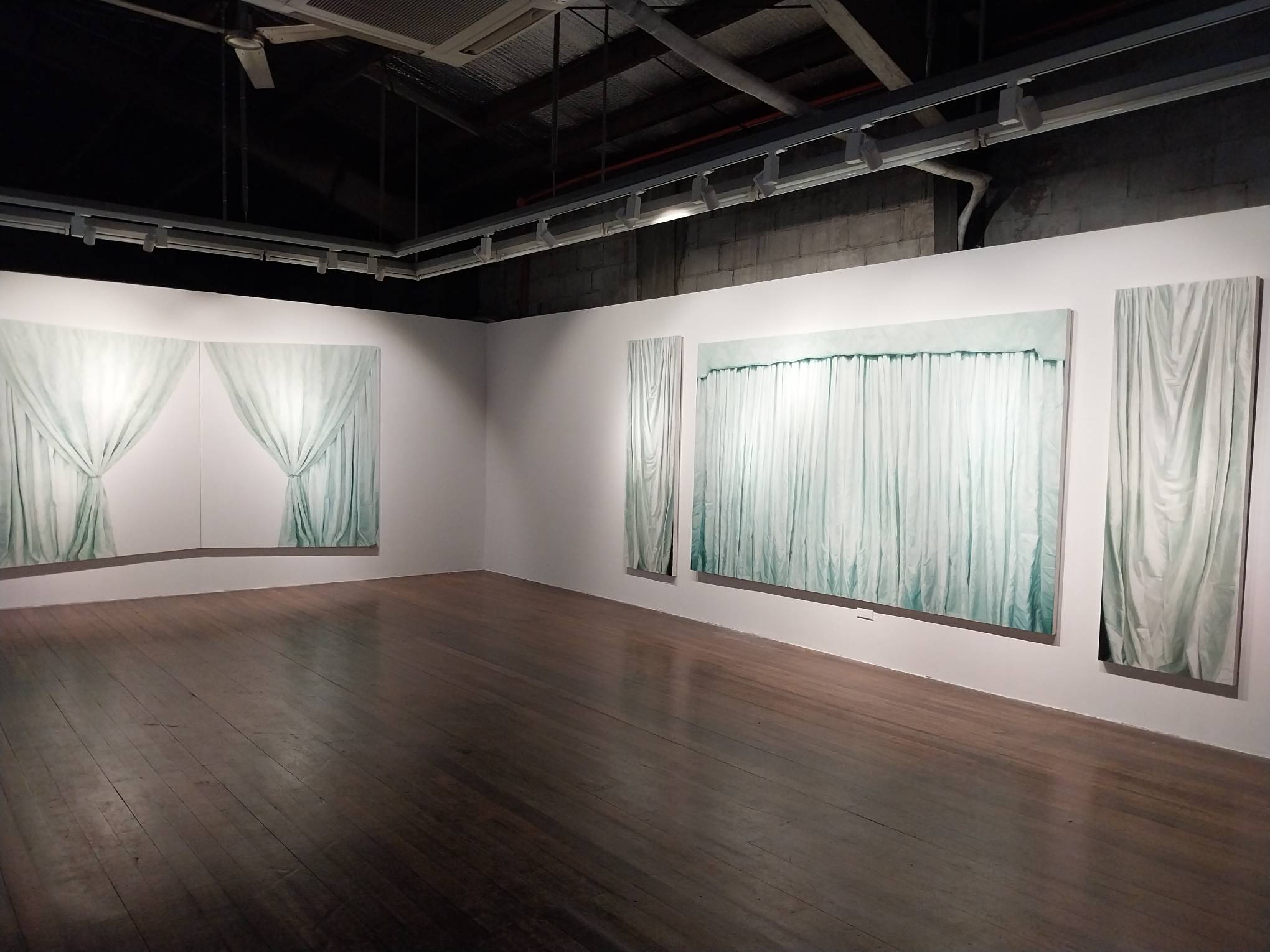 One of the art exhibits featured for this month's roundup, "Behind the Scenes" by Audrey Lukban.