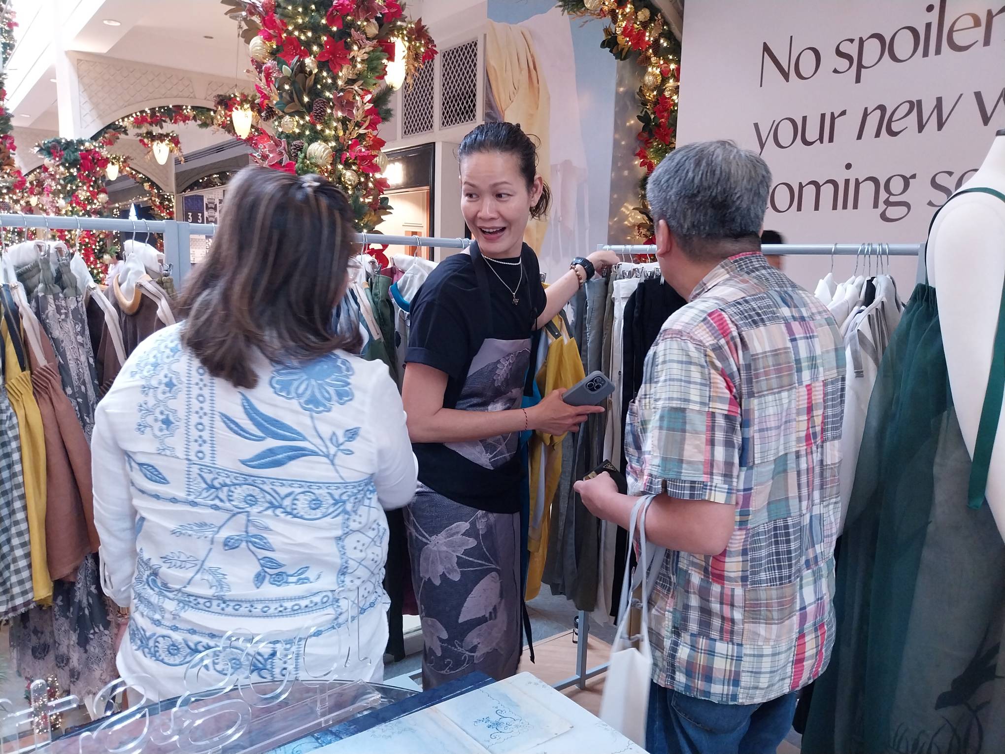 Jo Ann Bitagcol helping a shopper out during the opening.