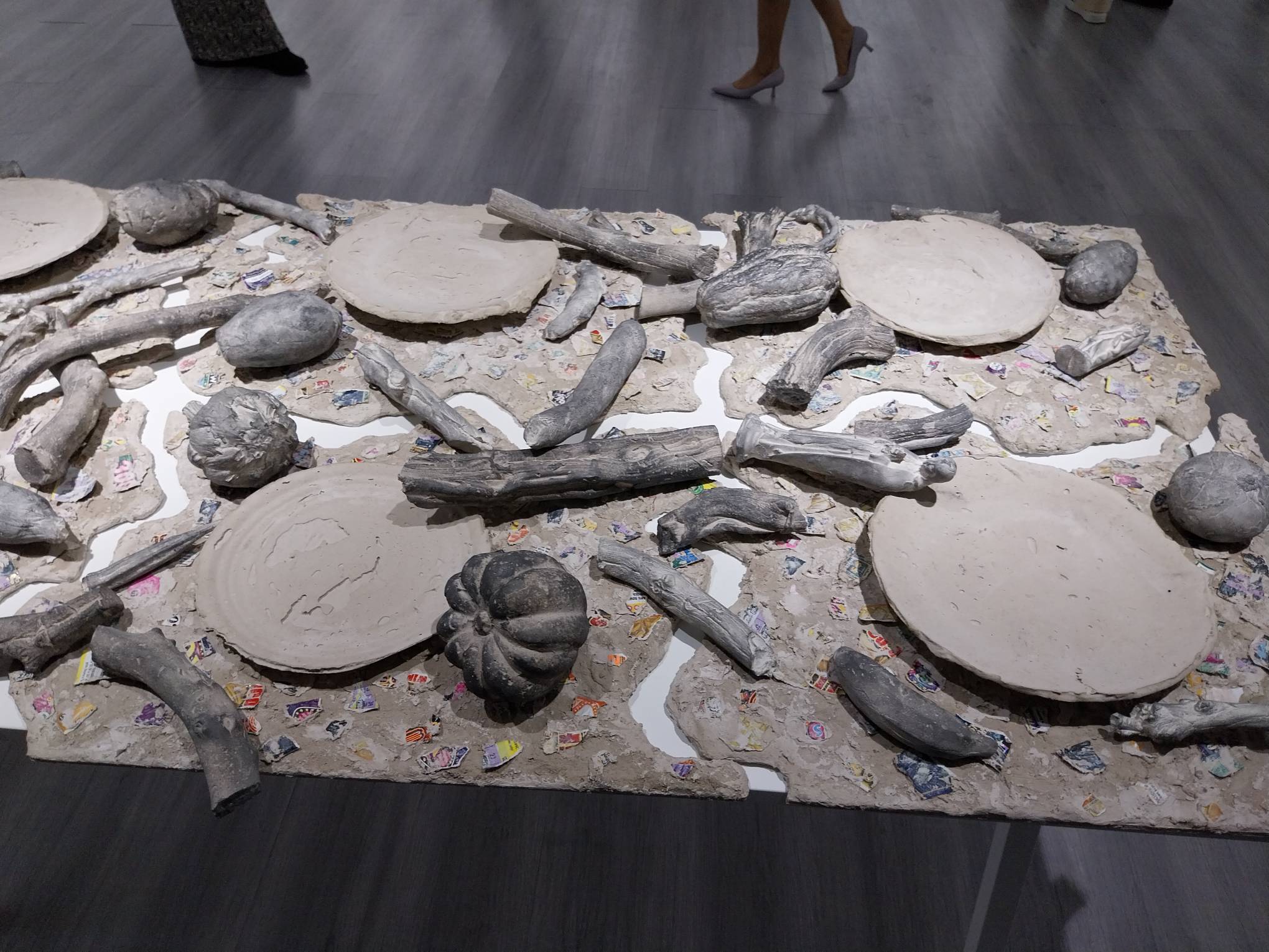 Close-up of the empty dinner table mixed media artwork for "Mother/land."