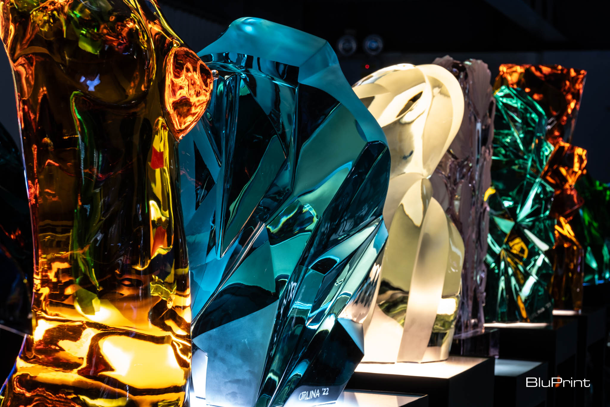 A collection of colorful glass sculptures by Ramon Orlina.