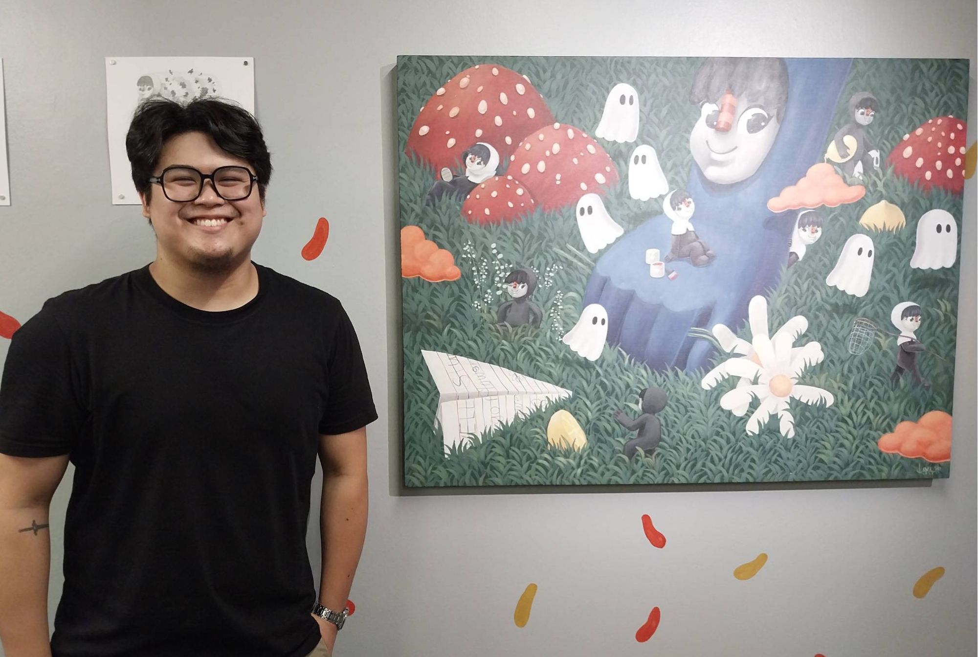 Jesse Camacho in front of one of his works for 