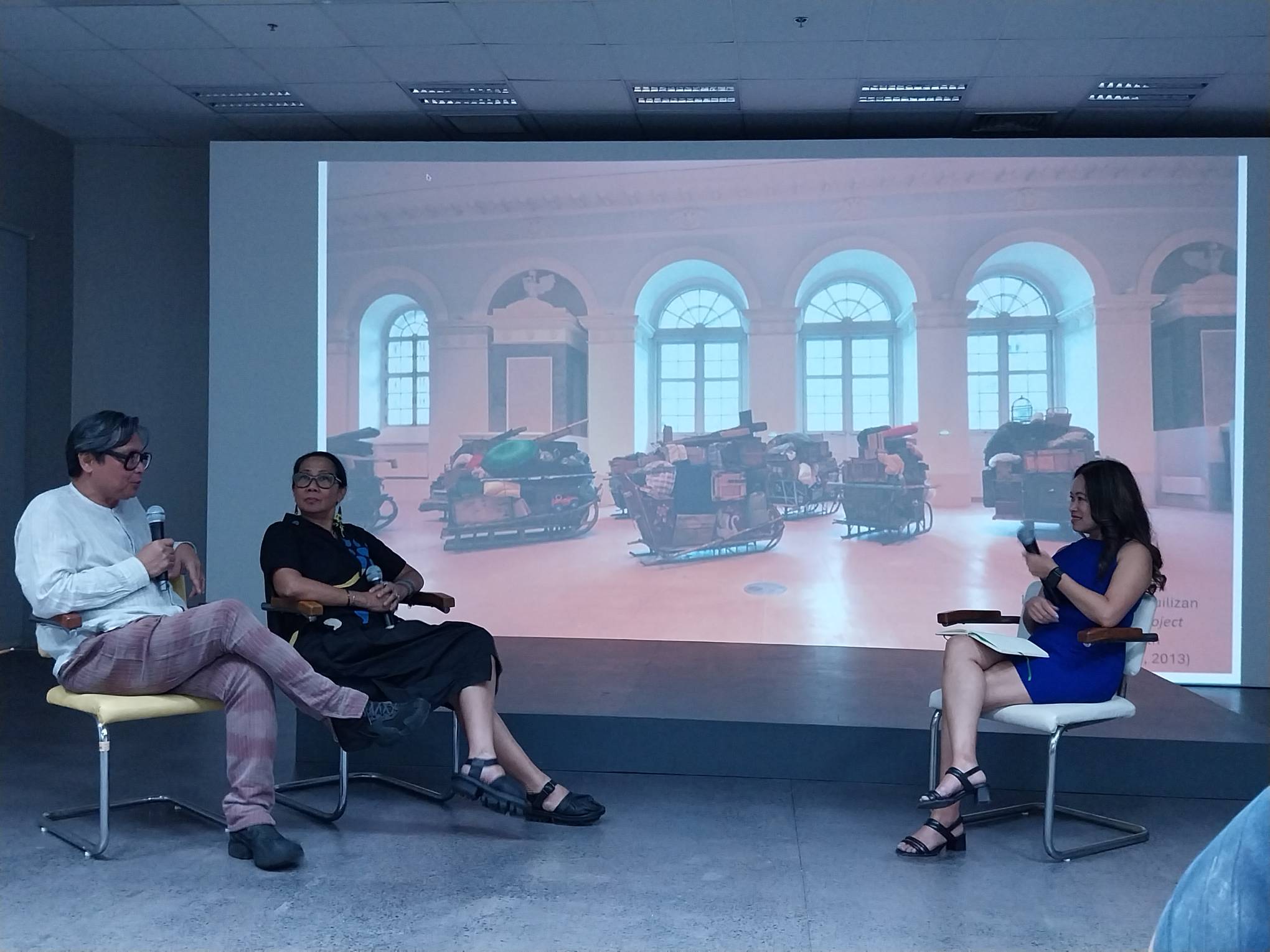 Kristine Guzman (right) and the Aquilizans discussing a work from Moscow.