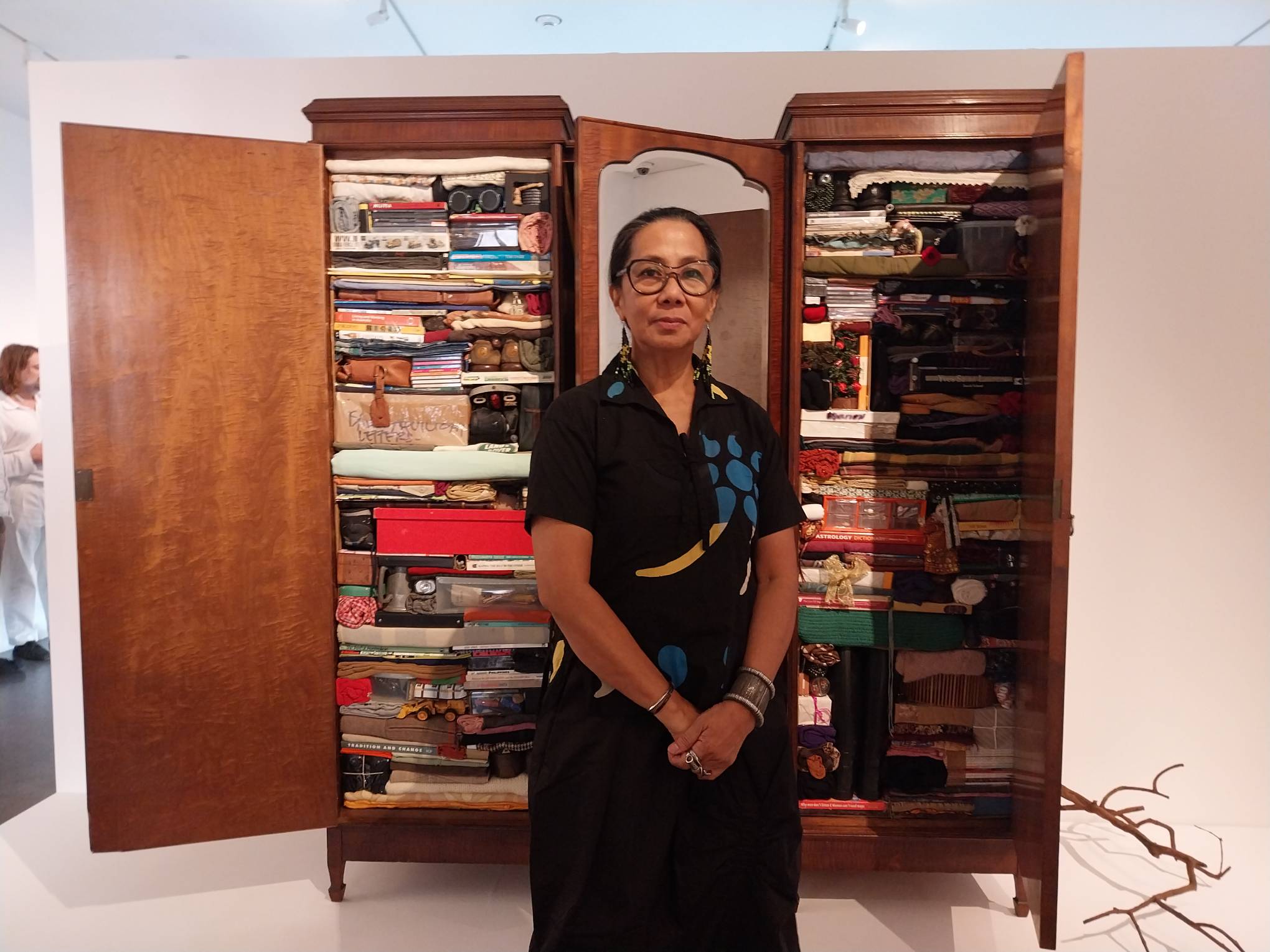 Isabel Aquilizan in front of "Foreigners: Project Another Country" for "Project Belonging."