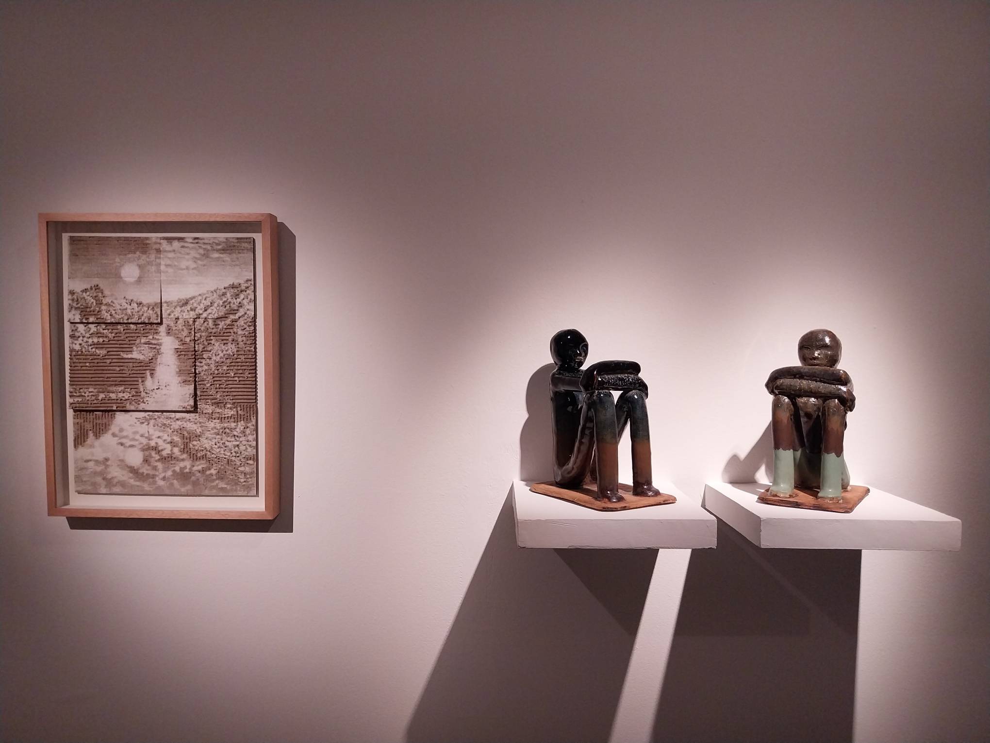 A cardboard laser-engraved work and sculptures by Jill Paz.