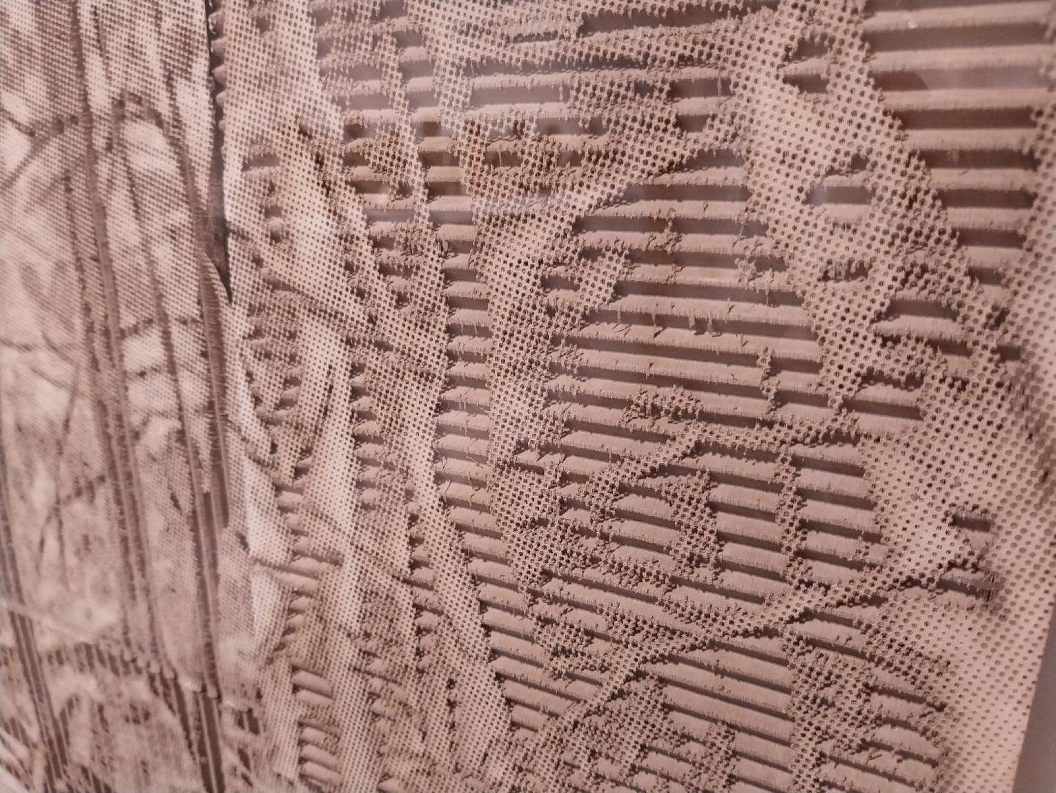 Details on the cardboard laser-engraved works at "Revirescence."