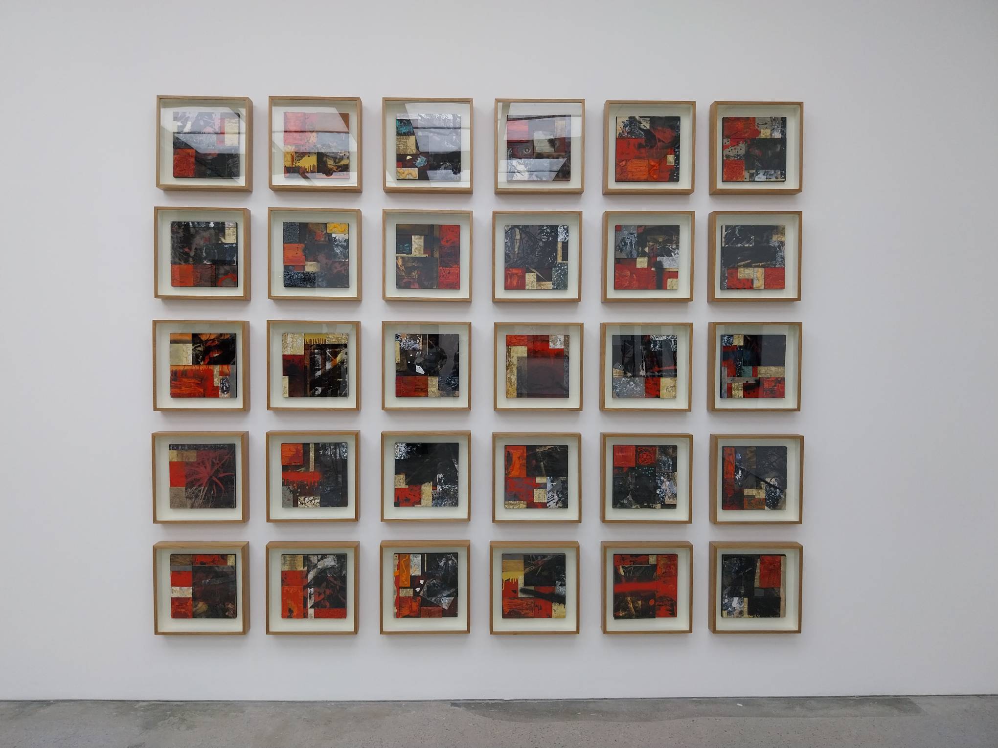 Thirty red paintings by Soler Santos for the Santos family exhibit at Silverlens Manila.