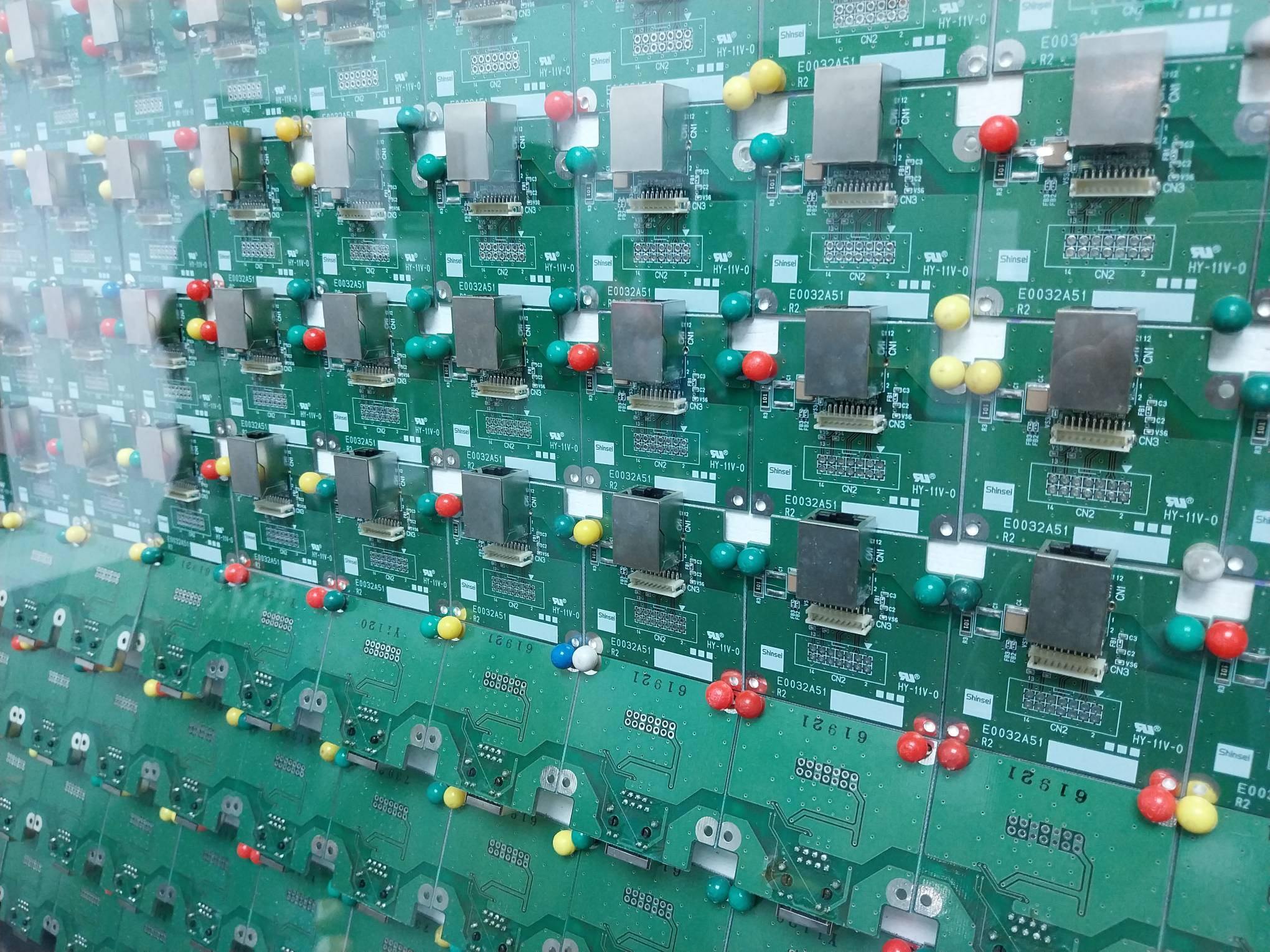 Close up of a microchip, soot, and seed work.