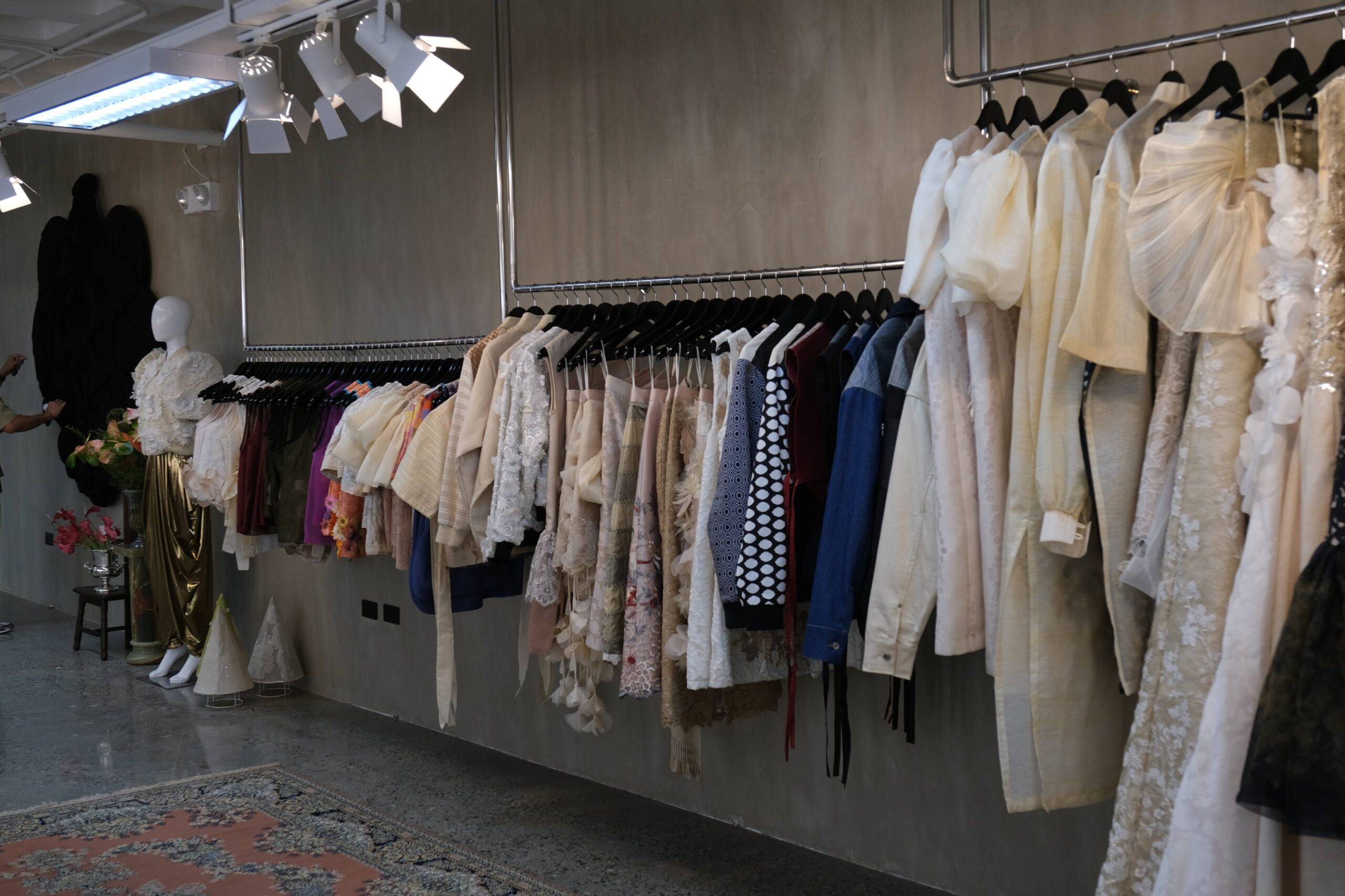 Racks of clothes by Jor-El Espina.