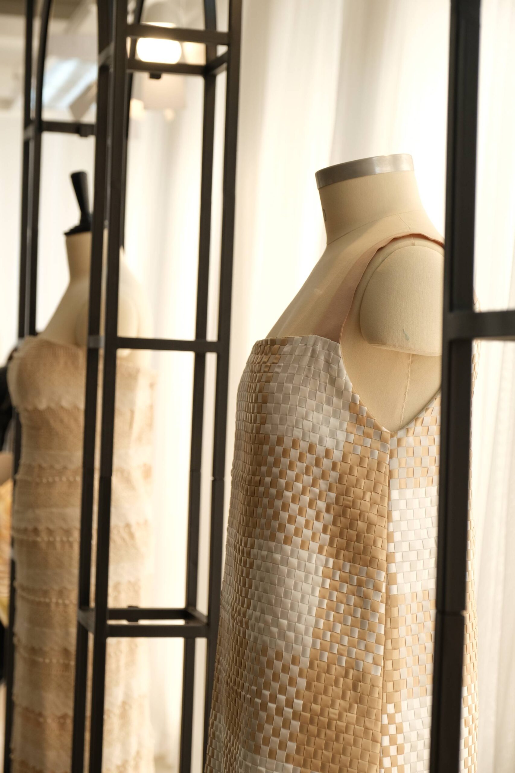 The dress with a banig-like design made with silk ribbons.