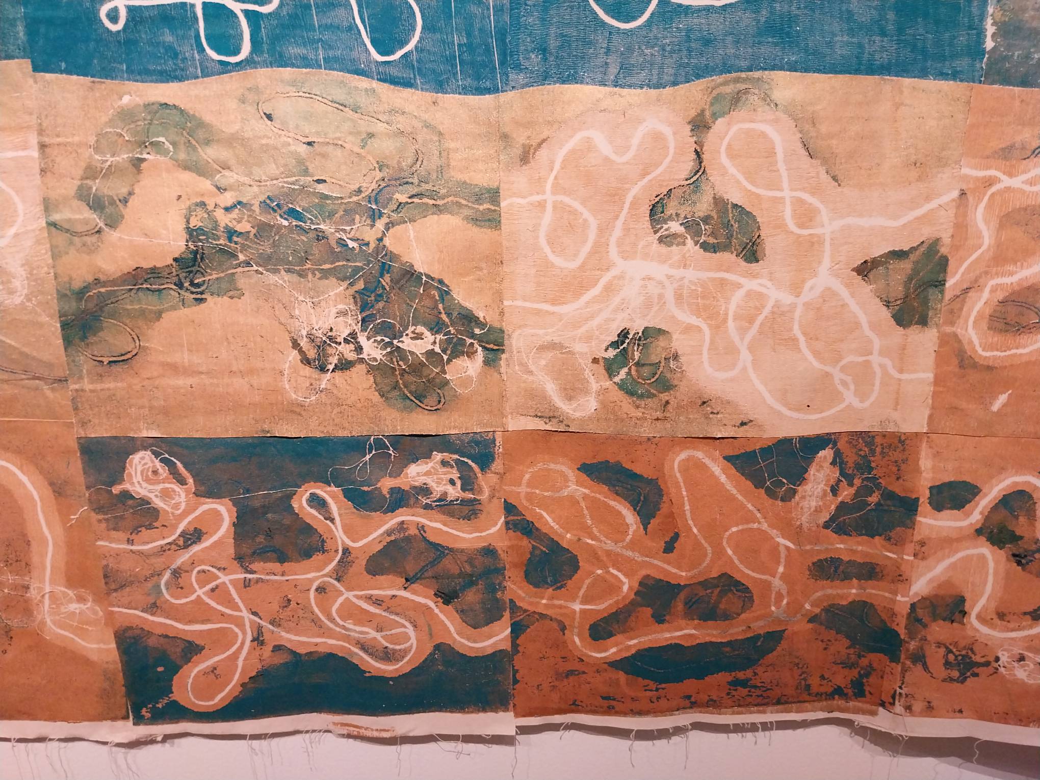 Close-up of "Sea, me, and sandscapes" showcasing some of the green parts of the work.