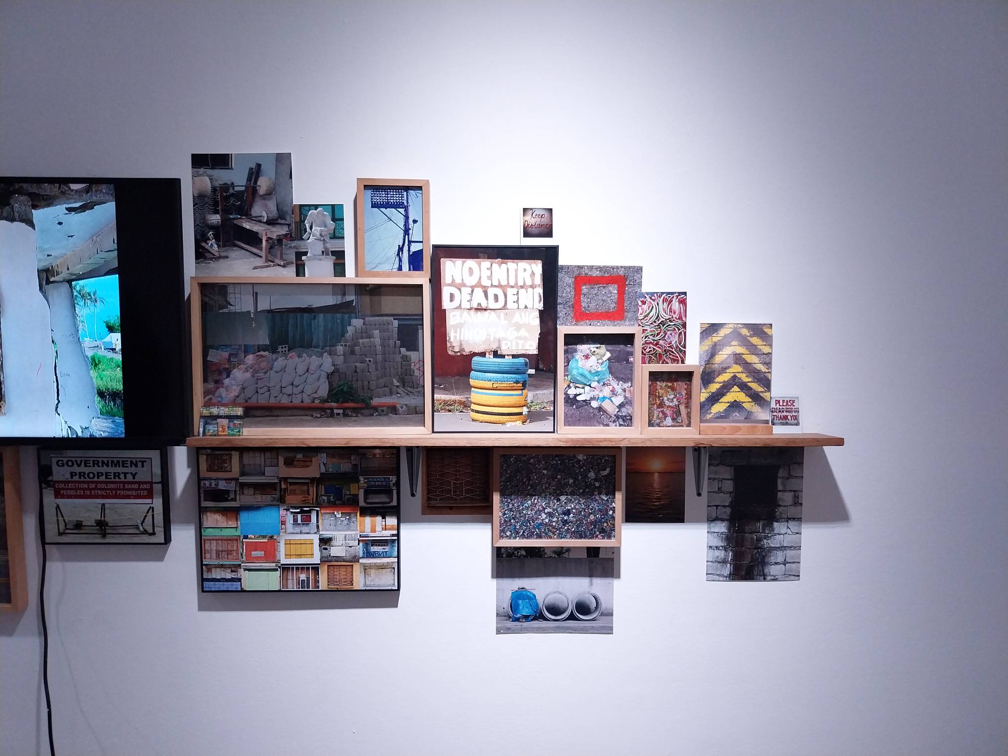 Multiple images of signs by MM Yu. Photo by Elle Yap.