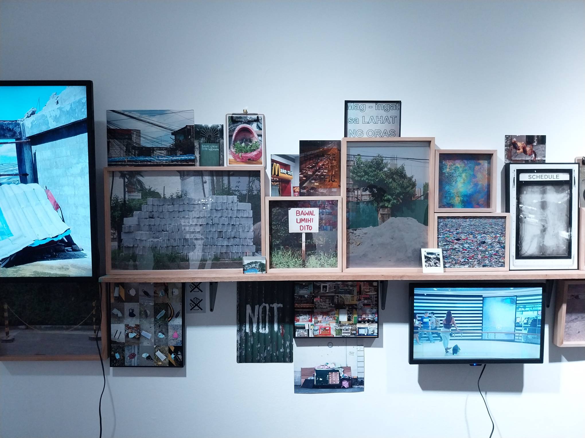 Multiple images of signs by MM Yu. Photo by Elle Yap.