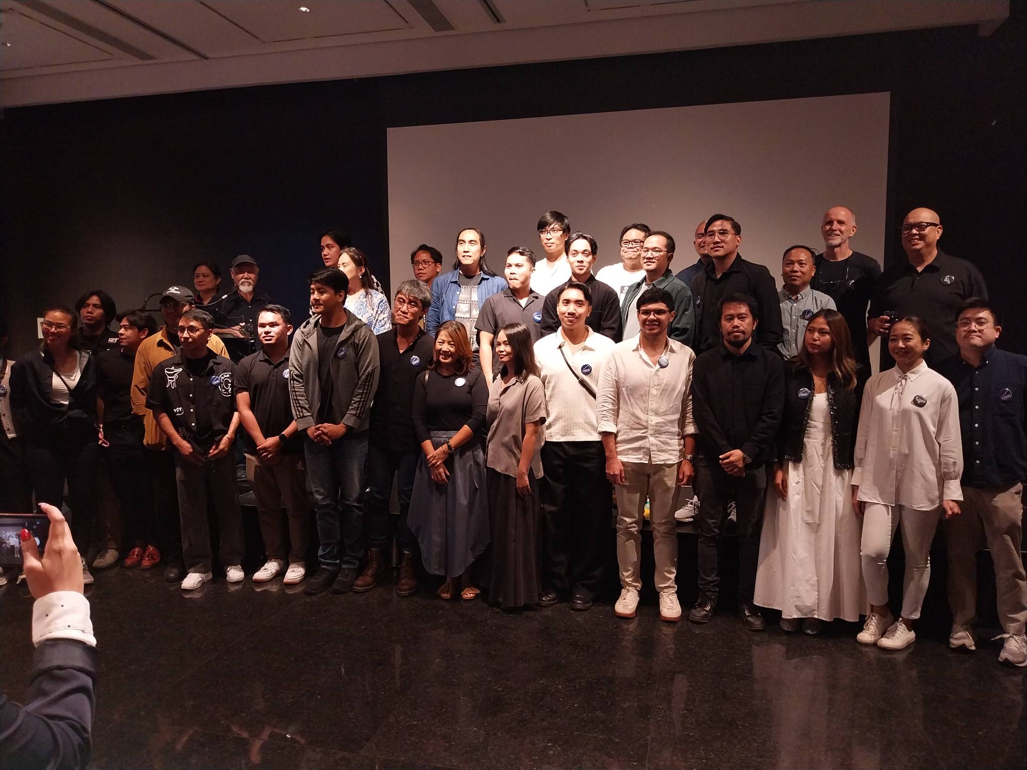 Some of the photographers chosen for the exhibit during the opening reception of "I/Land."