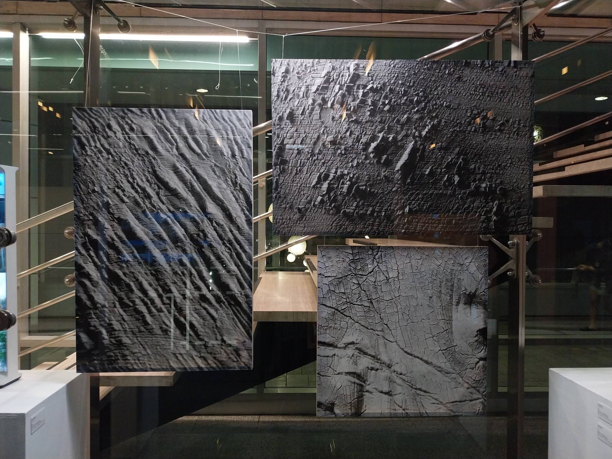 Three photographs for "Centrefold," the side exhibit shown alongside "I/Land."