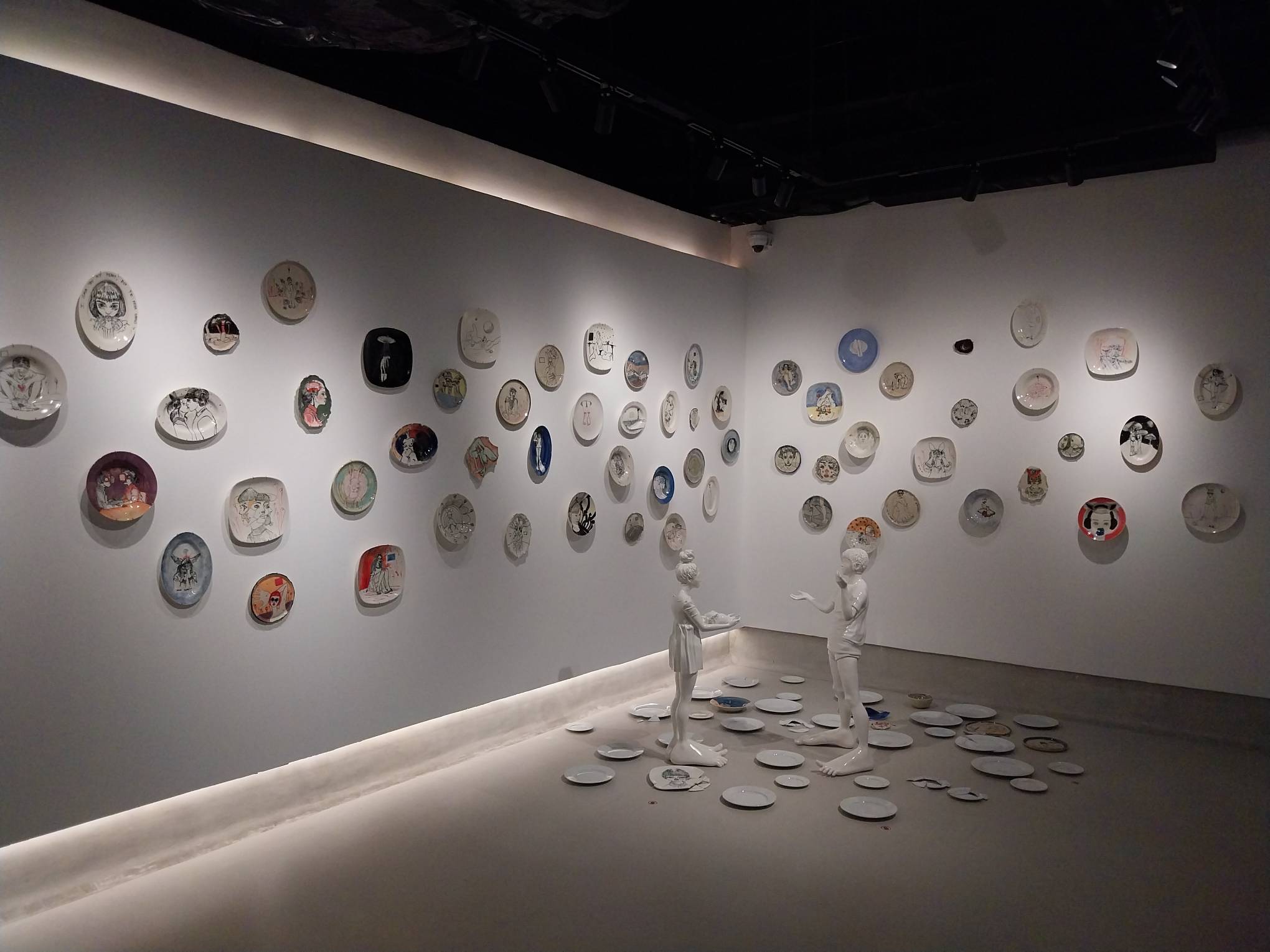 The artworks for "Breaking to Mend." The Ciane Xavier works, made of porcelain, surround the room.