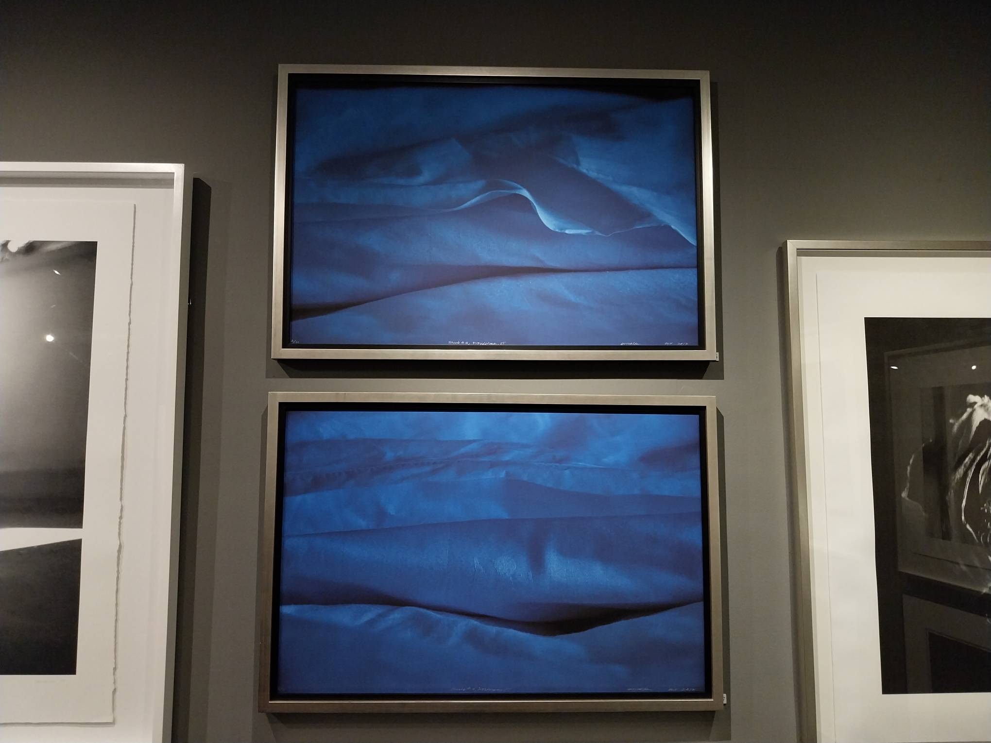 Two images of blue bedsheets by Denise Weldon.