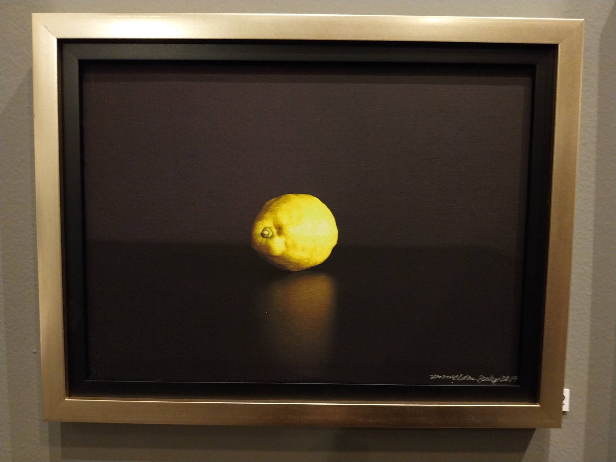 A work by Denise Weldon involving a yellow lemon.