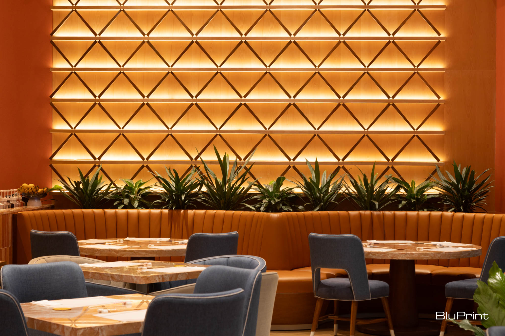 Seating areas set against a chopsticks wall at Kazu Cafe.