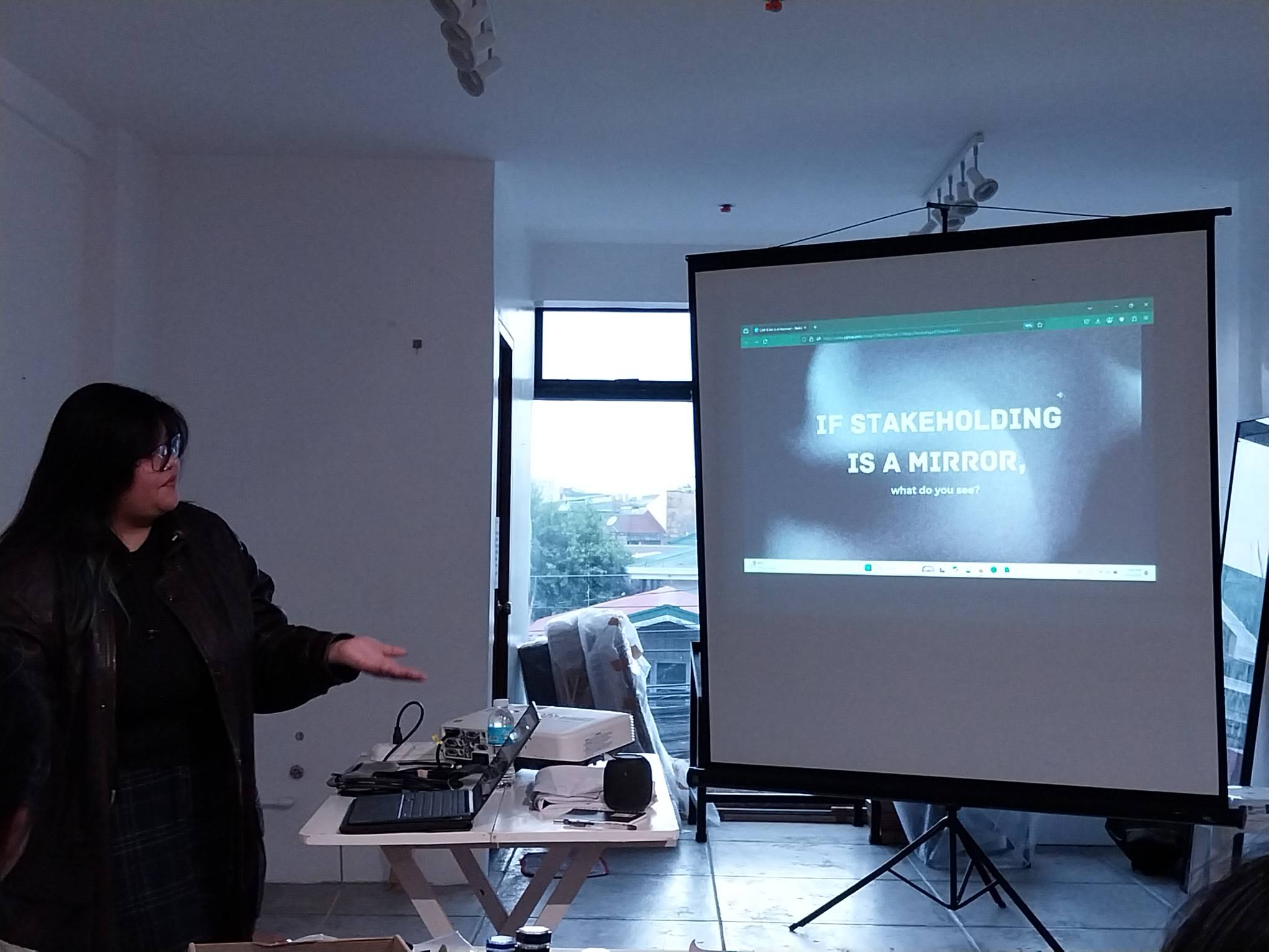 Game developer Nissie Arcega during a discussion about the game "Stakeholding."