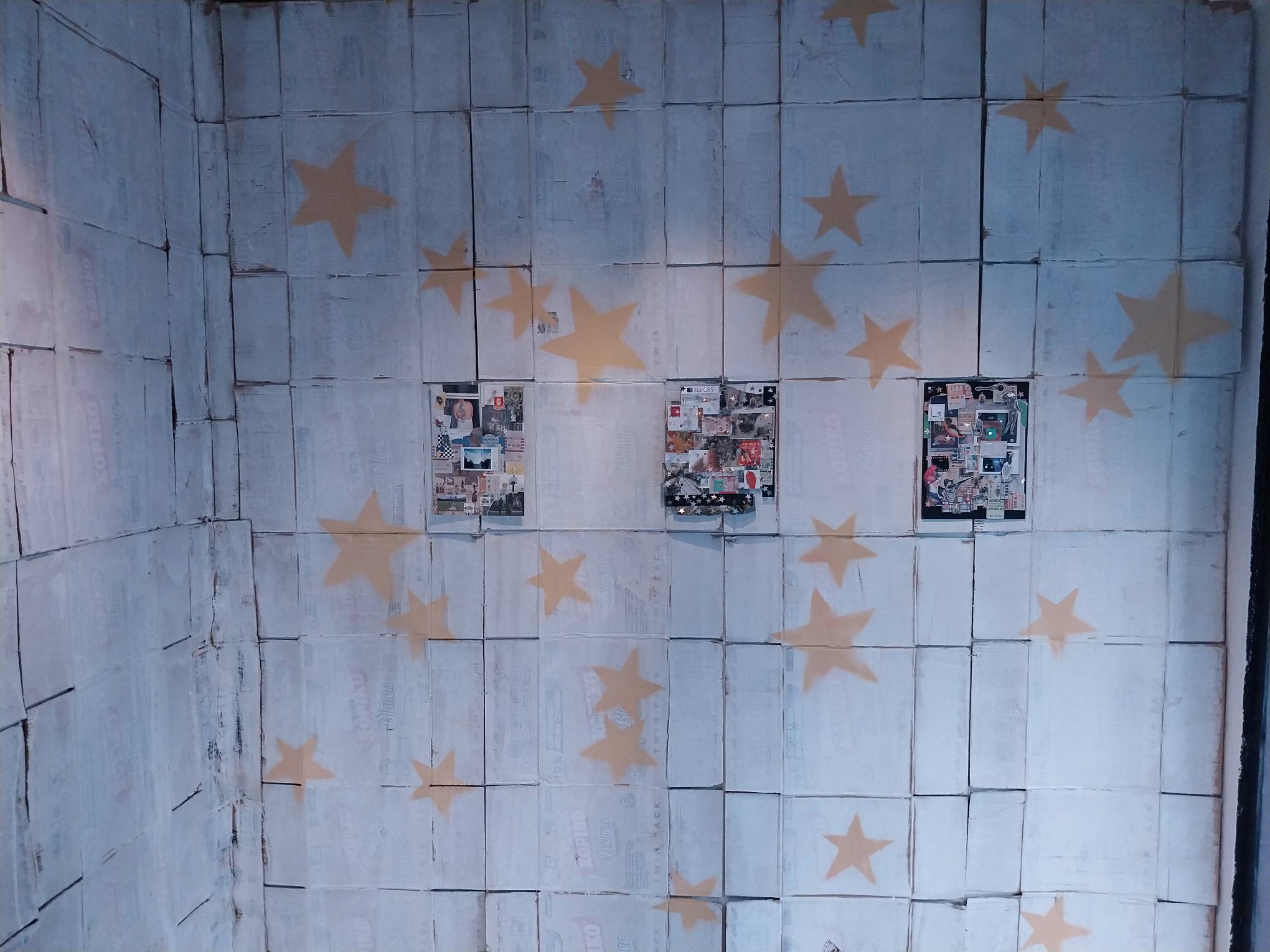 Walls of "Manila Medley" with the cardboard coverings and the painted stars.