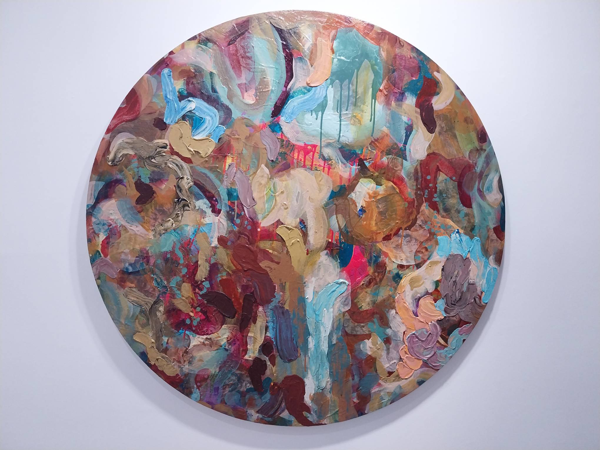 A circular painting in "Storm in a Teacup" by Patrick de Veyra. Photo by Elle Yap.