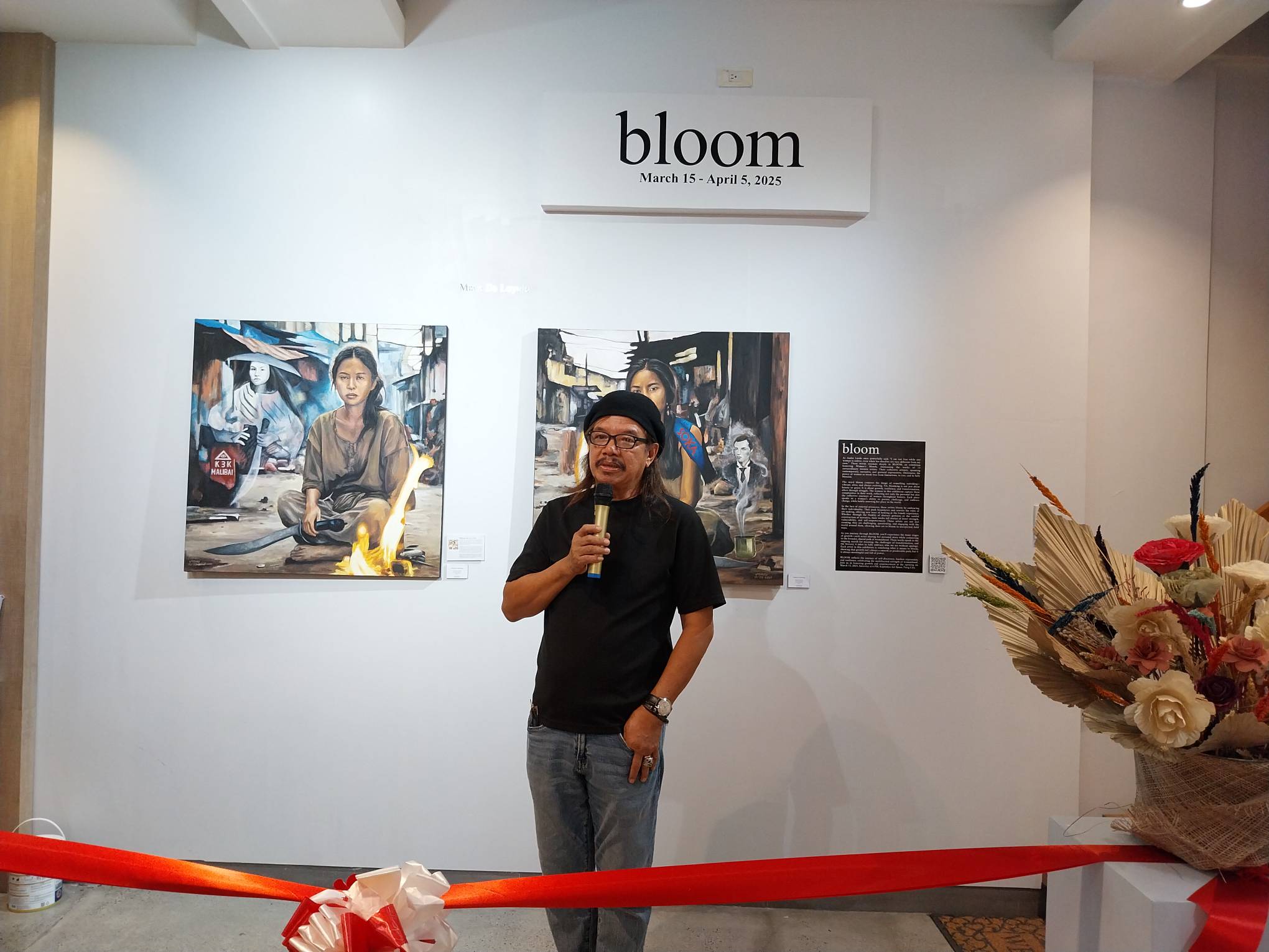 Artist Eghai Roxas during the opening of "Bloom."