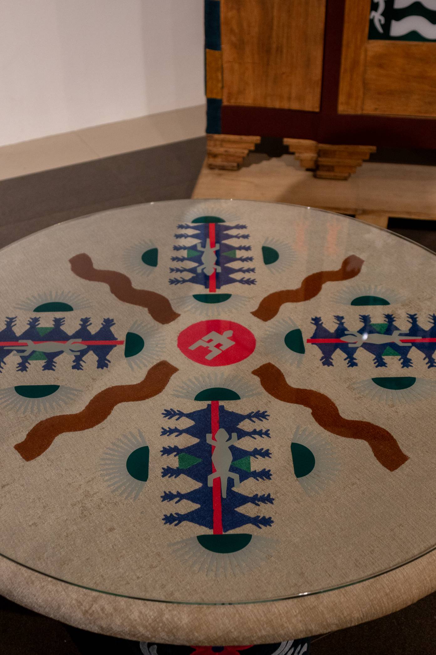 Glass table with drawn designs as shown in "The Infinite Dot."