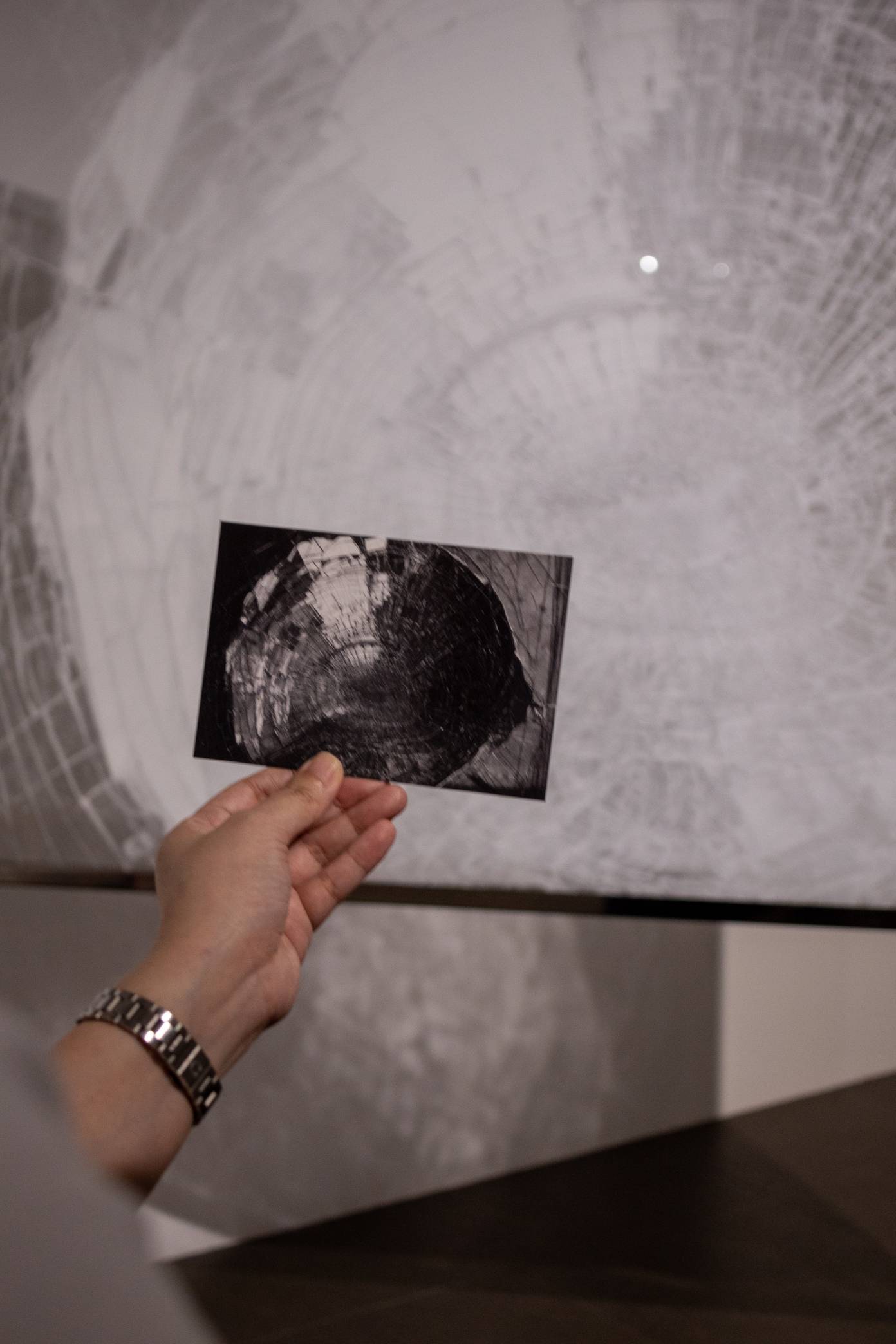 The original work by Luis Antonio Santos, with the new acrylic work in the background.