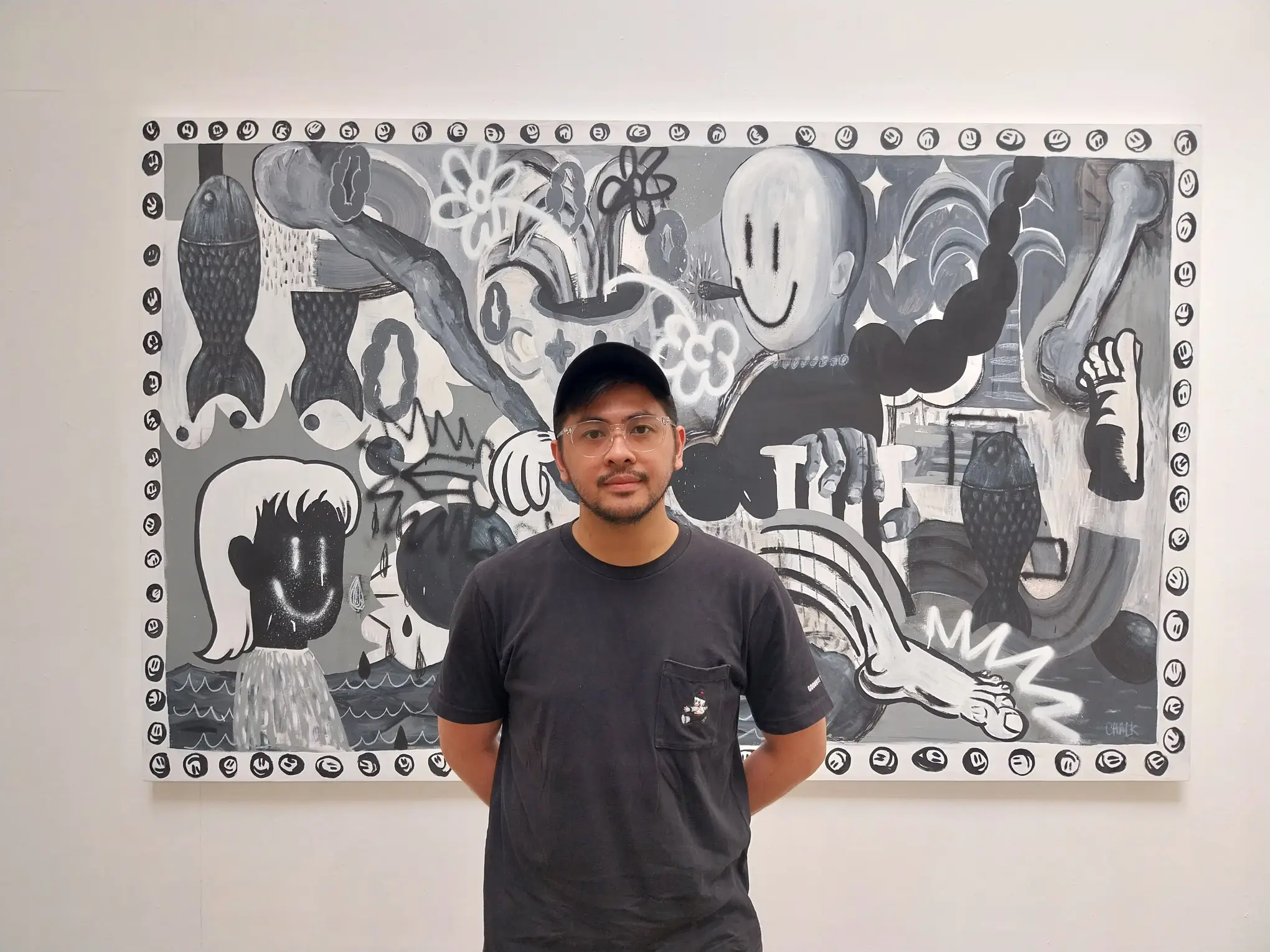 Artist Chalk Zaldivar in front of one of his paintings for "State of the Art."