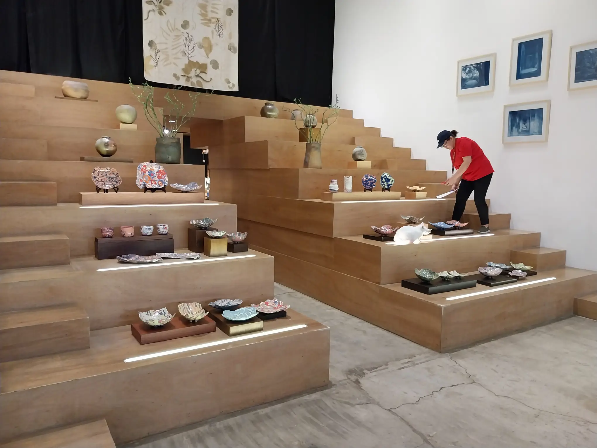A visitor looking at some of the works at "Nerikomi" by Winnie Go.
