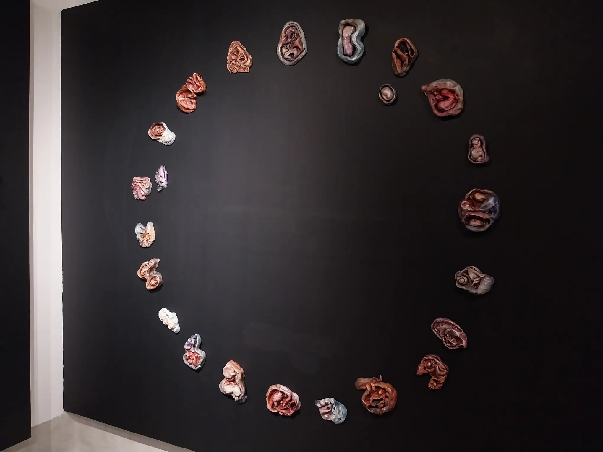 Sam Feleo's ceramic works arranged in a circular shape.