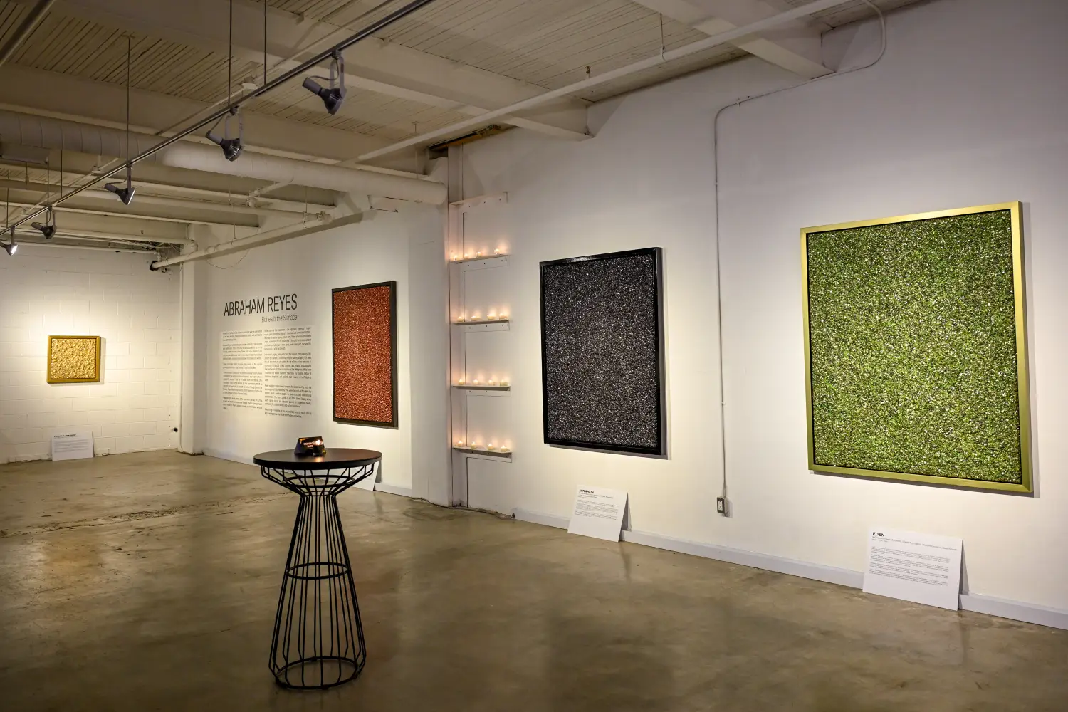 "Beneath the Surface" exhibit with some of the artworks displayed.