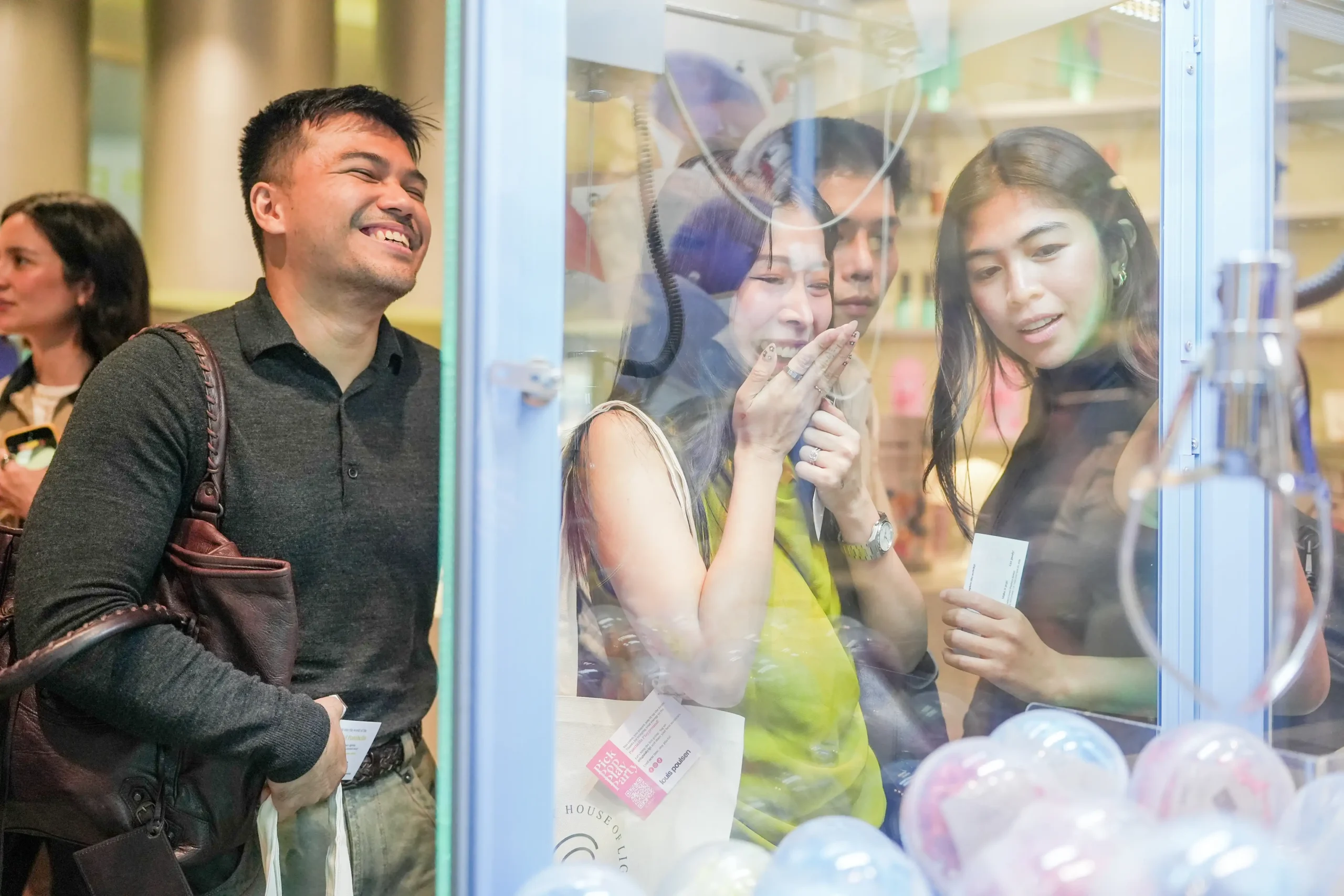 Guests playing at the claw machine.