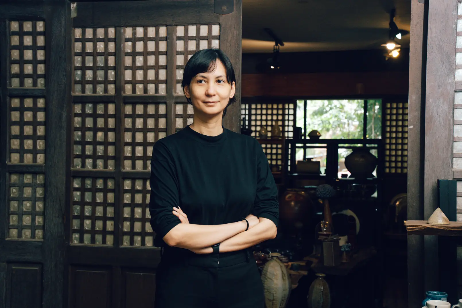 Artist Hanna Pettyjohn smiling and looking at a distance.