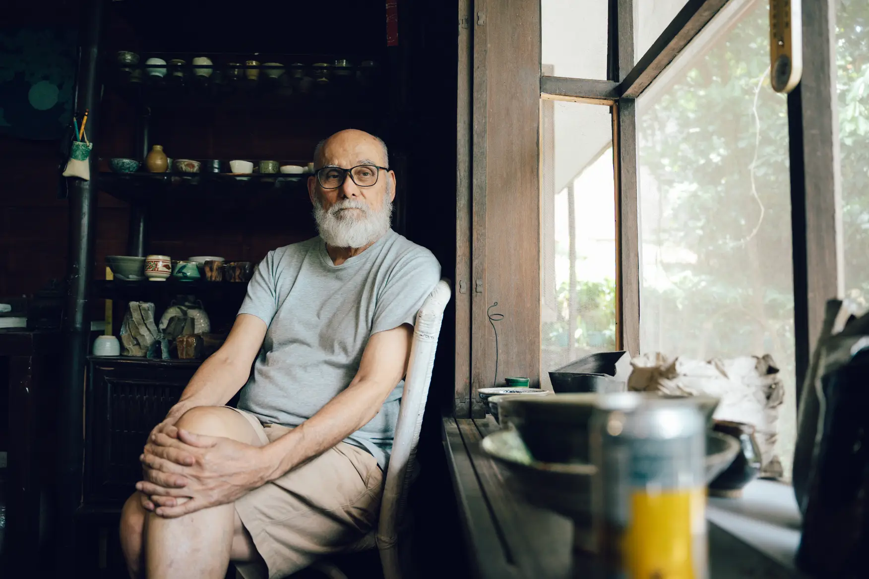 Jon Pettyjohn looking contemplatively at a window.