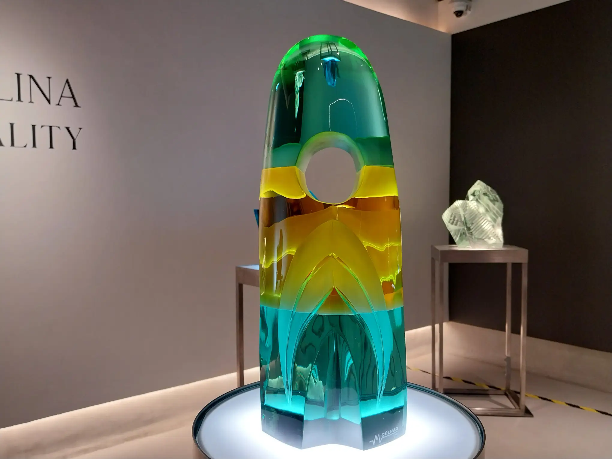A glass sculpture by Michael Orlina in the shape of a rocket.