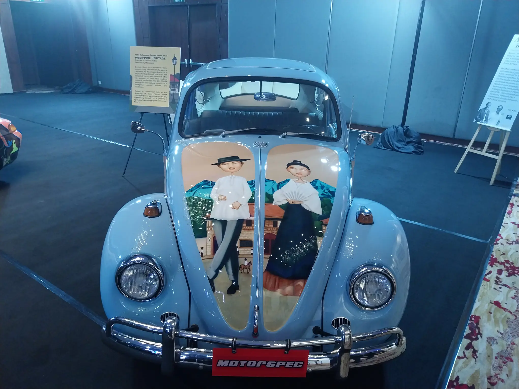 Volkswagen Beetle with Dominic Rubio's painting on the hood.