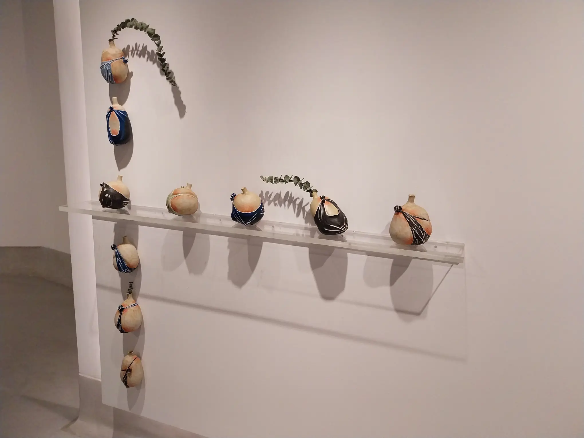 Some pottery works shown at "softly, firmly."