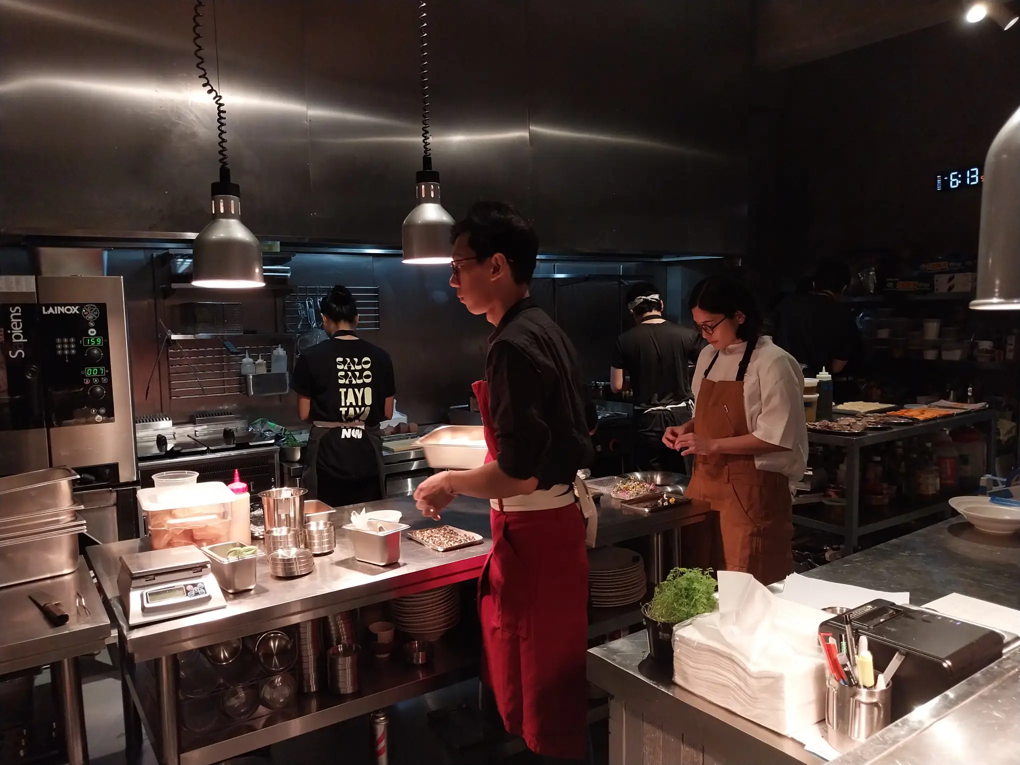 Isabel Reyes Santos helping out the kitchen staff.