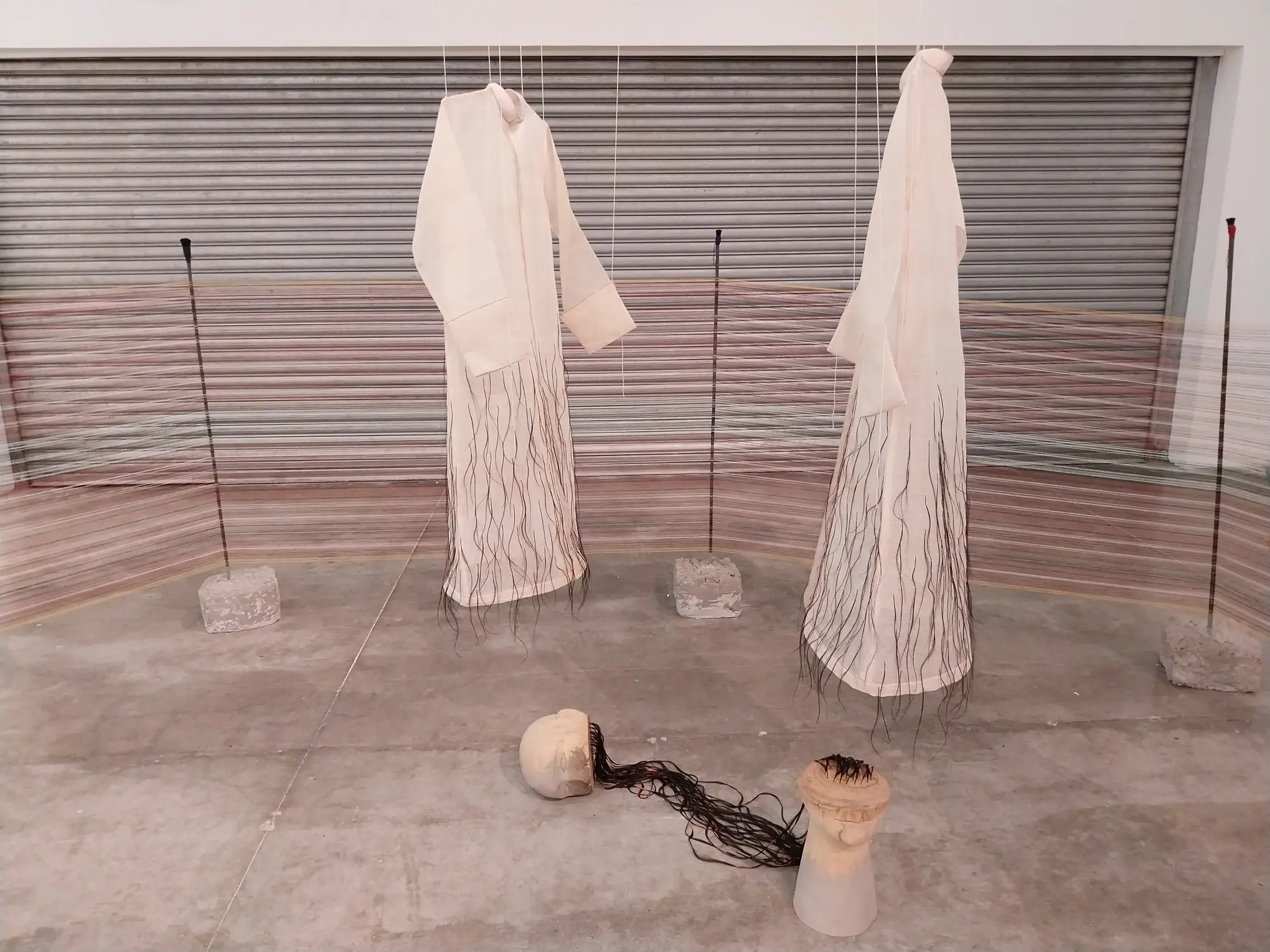 The cassock portion of Rocky Cajigan’s “A barrier, a time II” at "Moments of Delay."