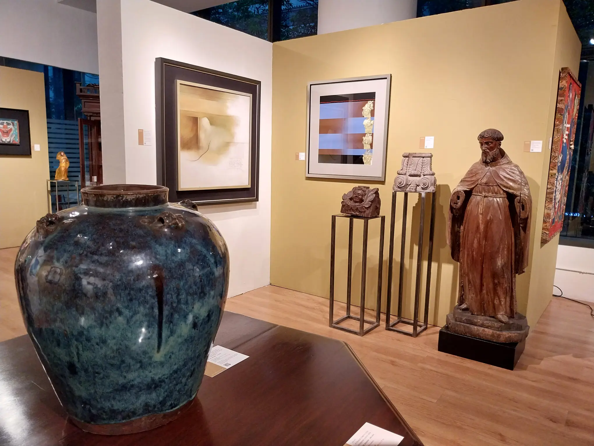 Paintings and sculpture found at the auction.