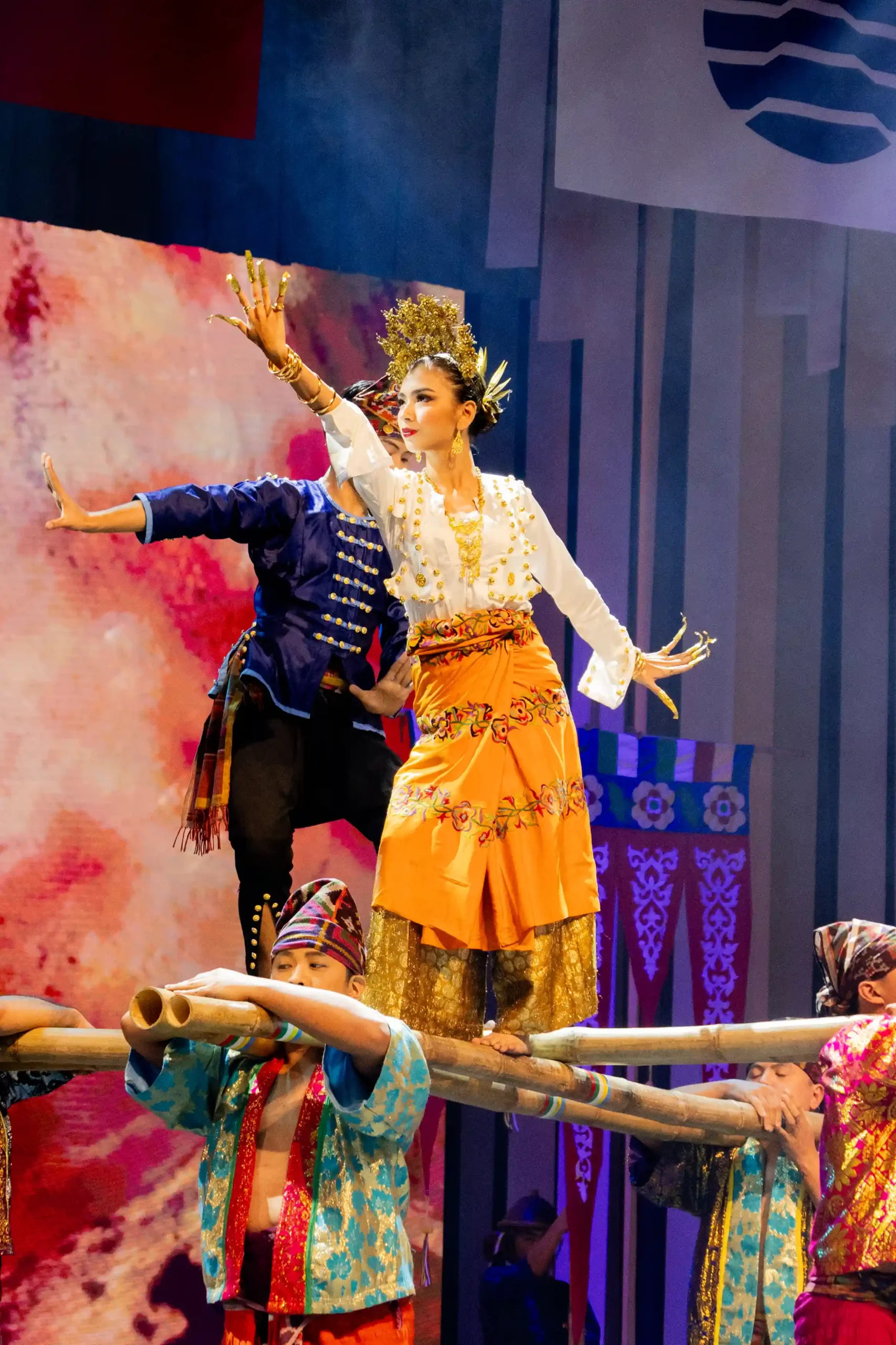 The Pangalay Sheherada and Pangalay Ha Pattung dances from the Tausug of Mindanao are rich in elaborate movements, traditionally performed during community celebrations. Performers wear silk ensembles adorned with tambuku (gold buttons), with the habul tiyahian sash for women and pis siabit head cloth for men.