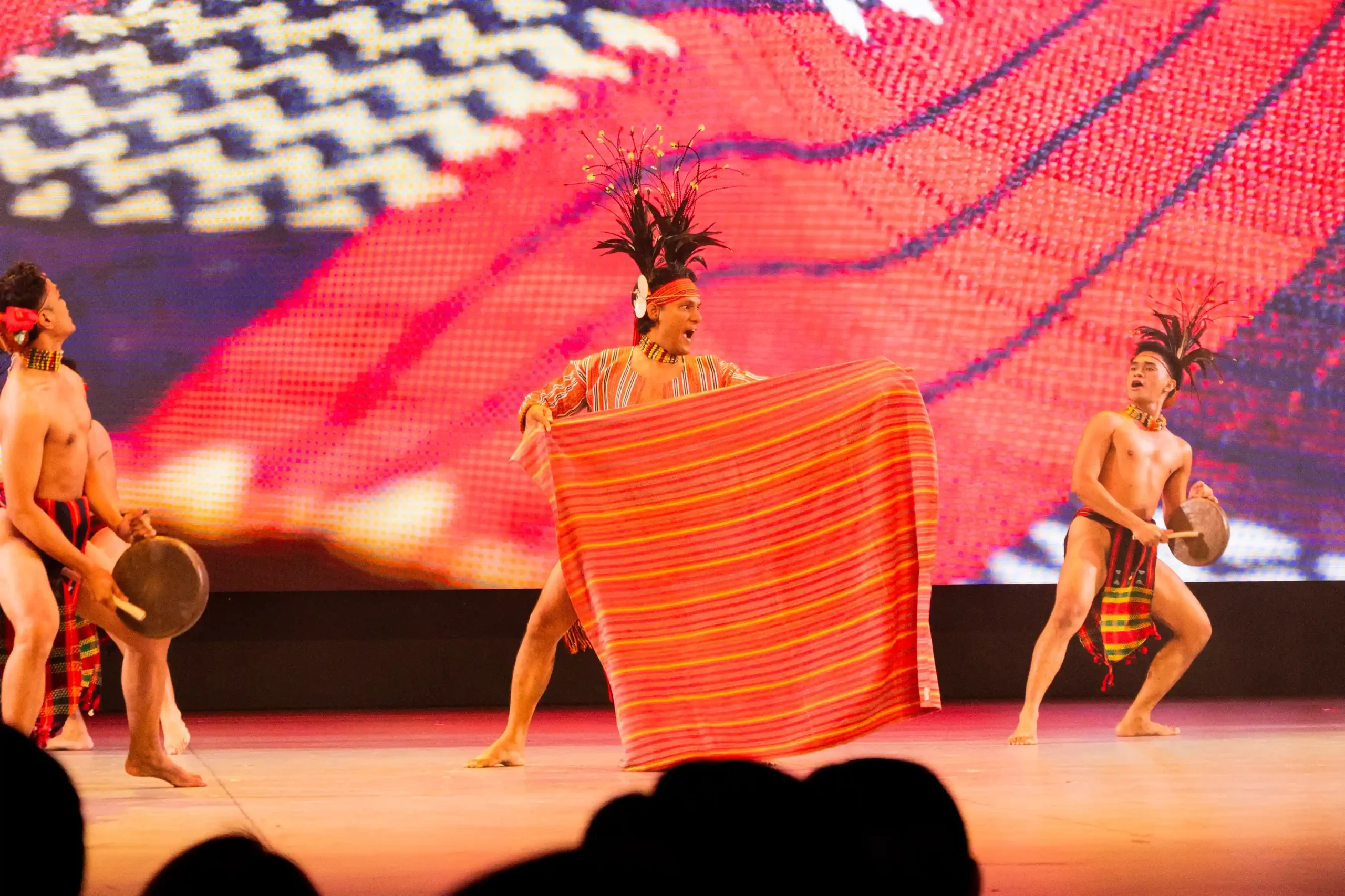 Dancers from the Kalinga region wear kain (wraparound skirt) and silup ang-anga (topper) for the women, while men wear a ba’ag (G-string) with tinali (belt), ong-ong (ornaments), and suklang (headgear).